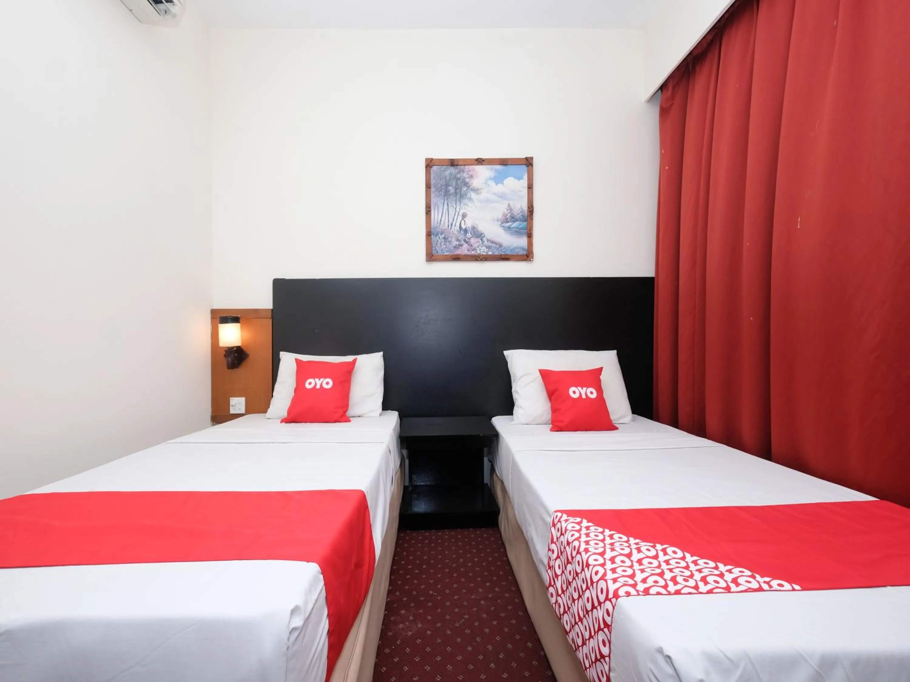 Bedroom in OYO 89968 Sri Sutra Hotel