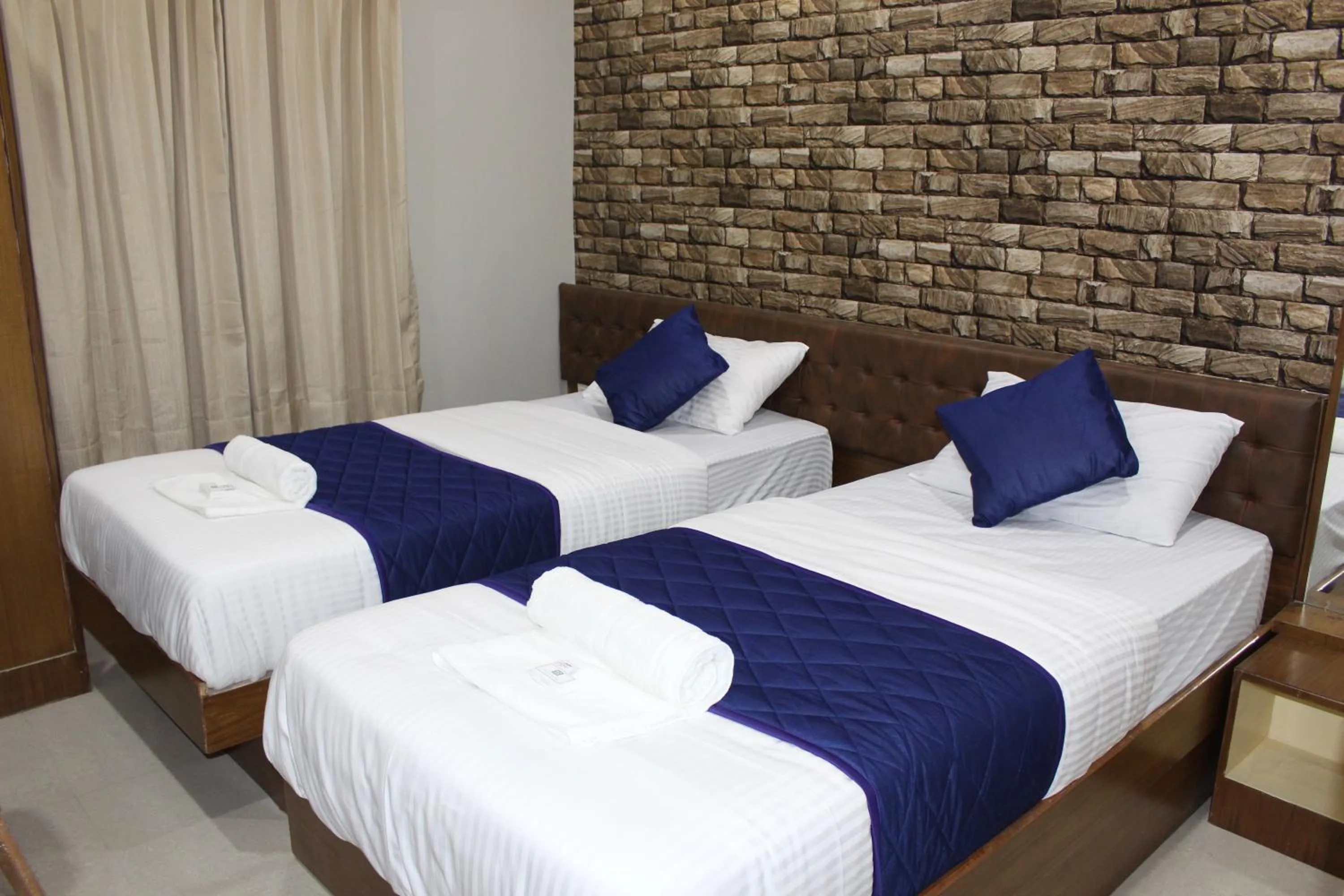 Bed in Olivia Inn And Suites