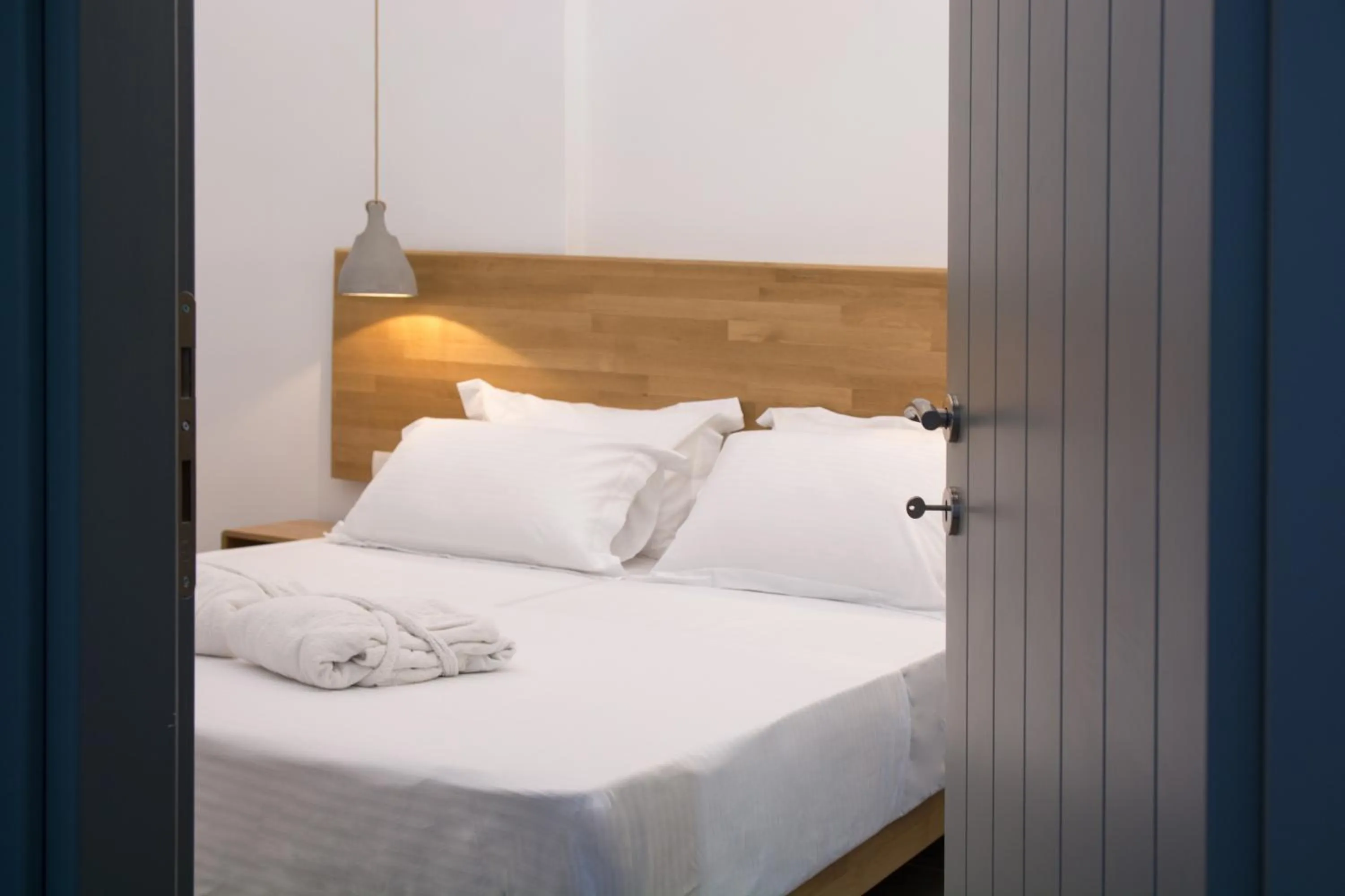 Bed in Amphitrite Suites Santorini