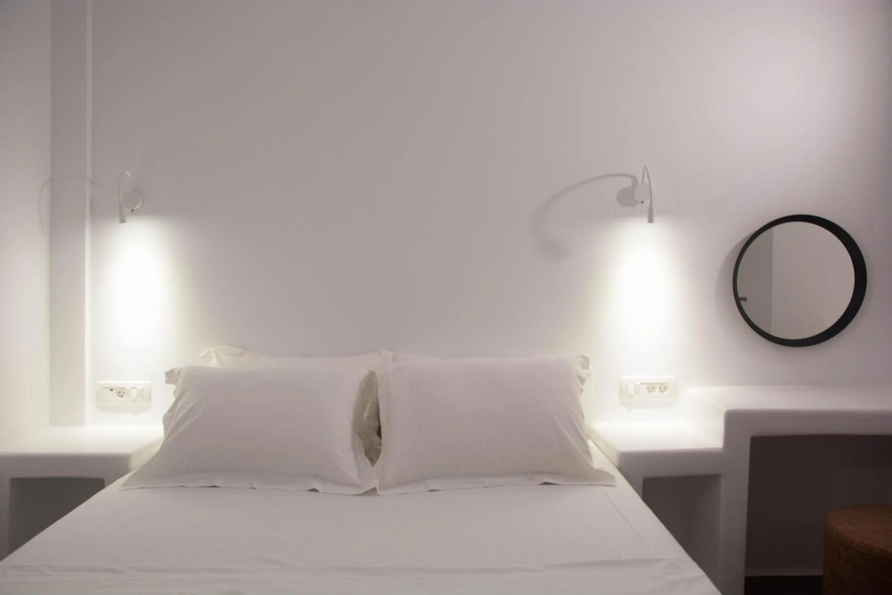 Bed in Amphitrite Suites Santorini