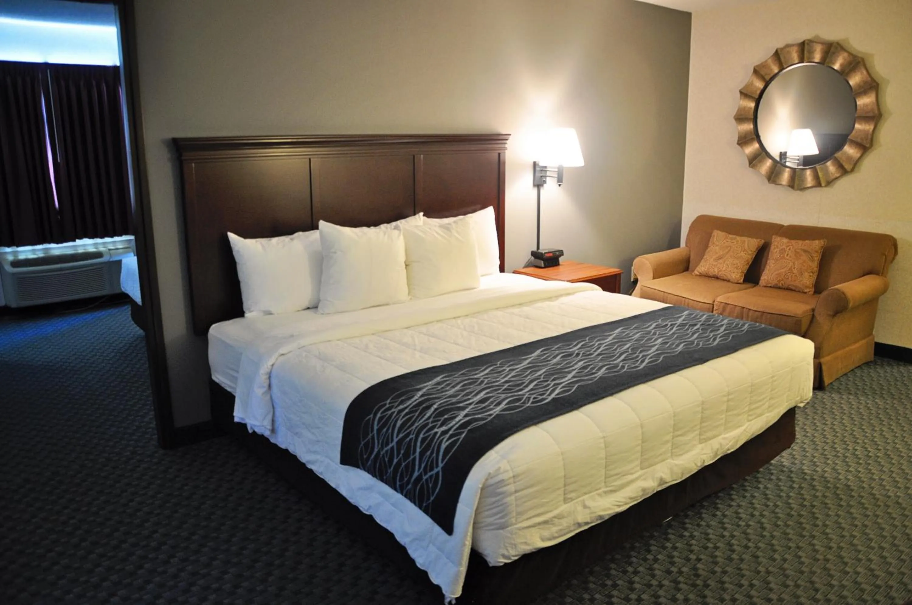Bed in Dunes Express Inn and Suites