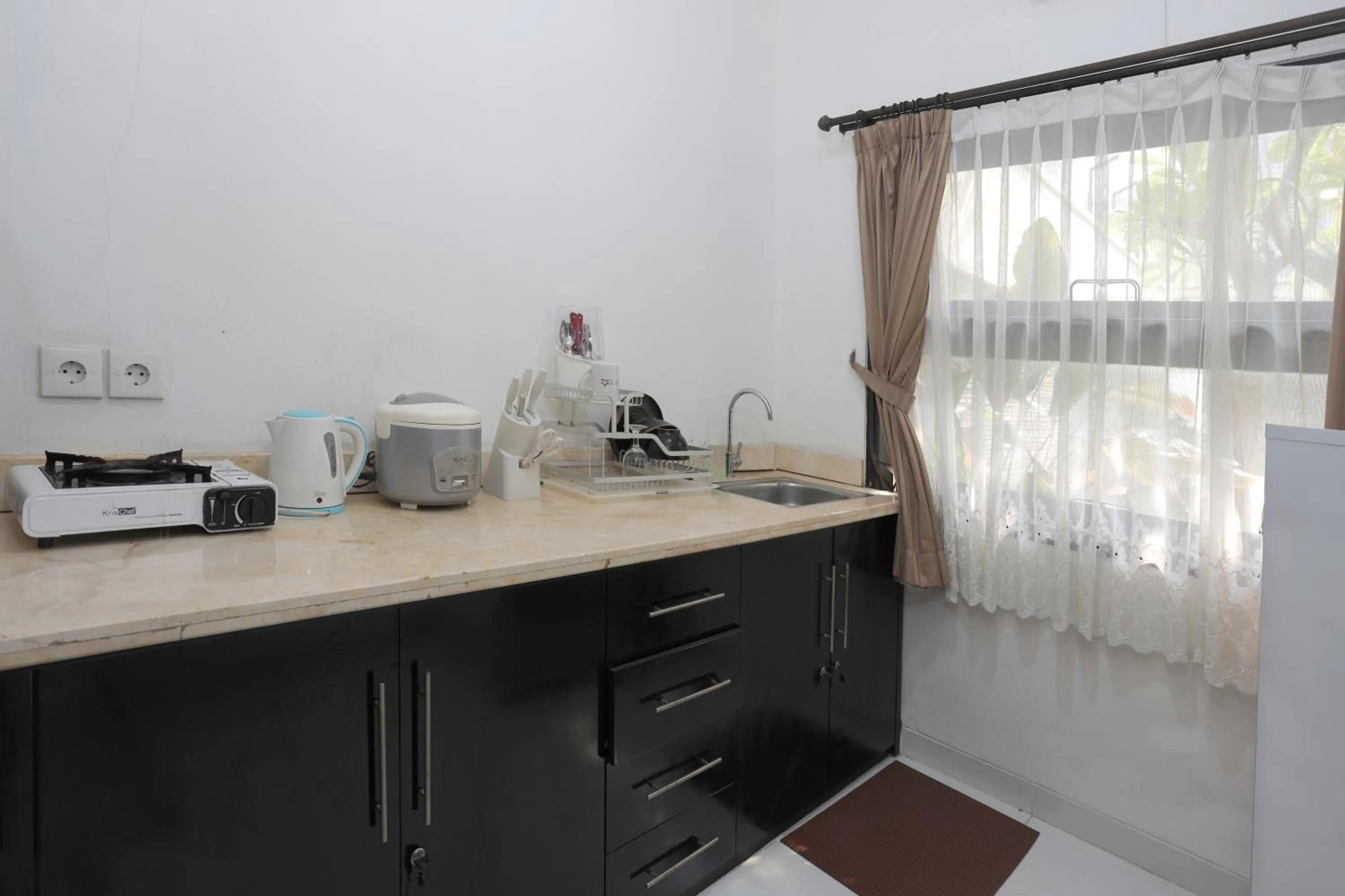 Kitchen or kitchenette in Jambuluwuk Residence Menteng