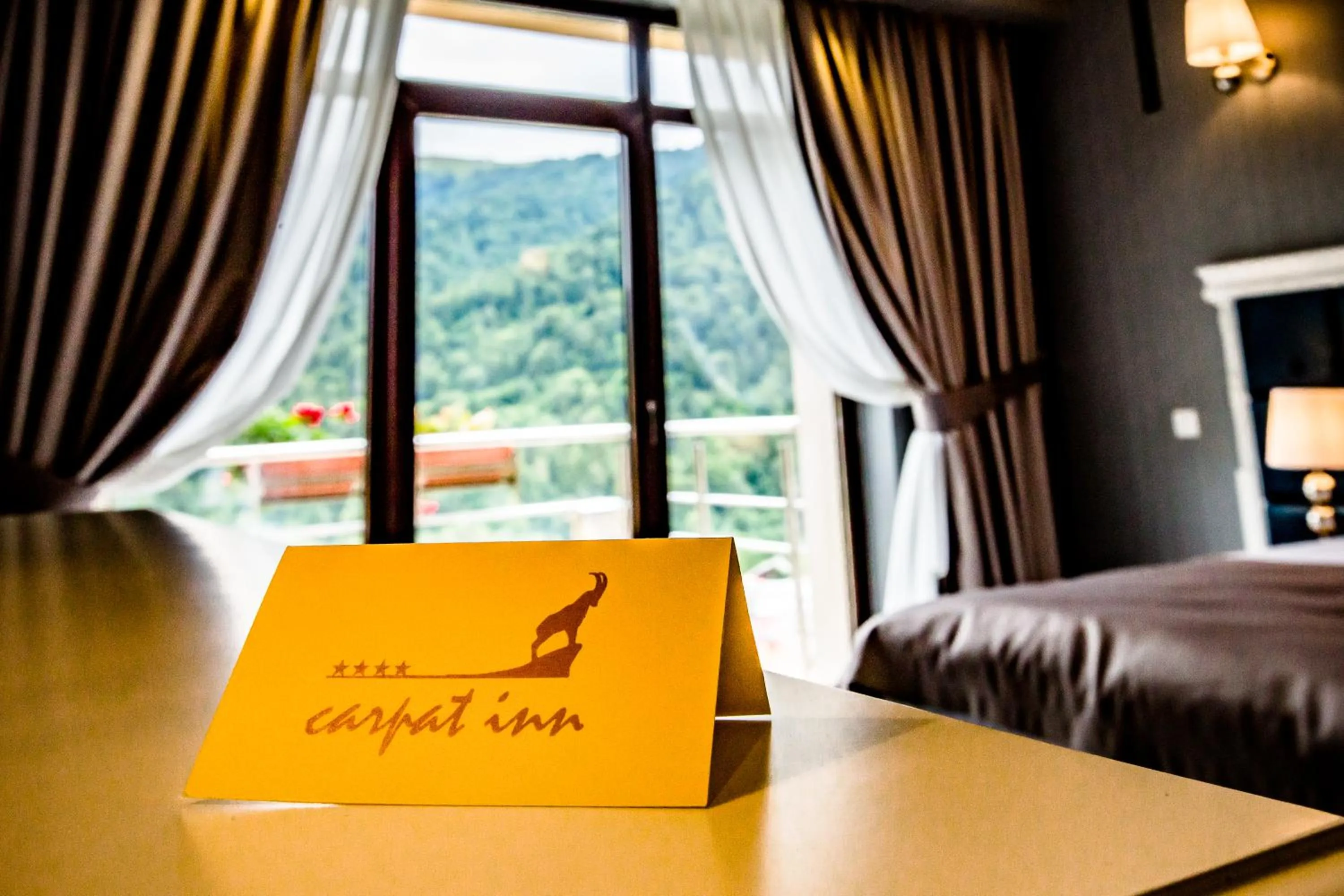 Property logo or sign, Bed in HOTEL CARPAT INN