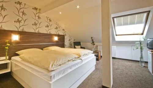 Bed in Hotel Am Rosenberg