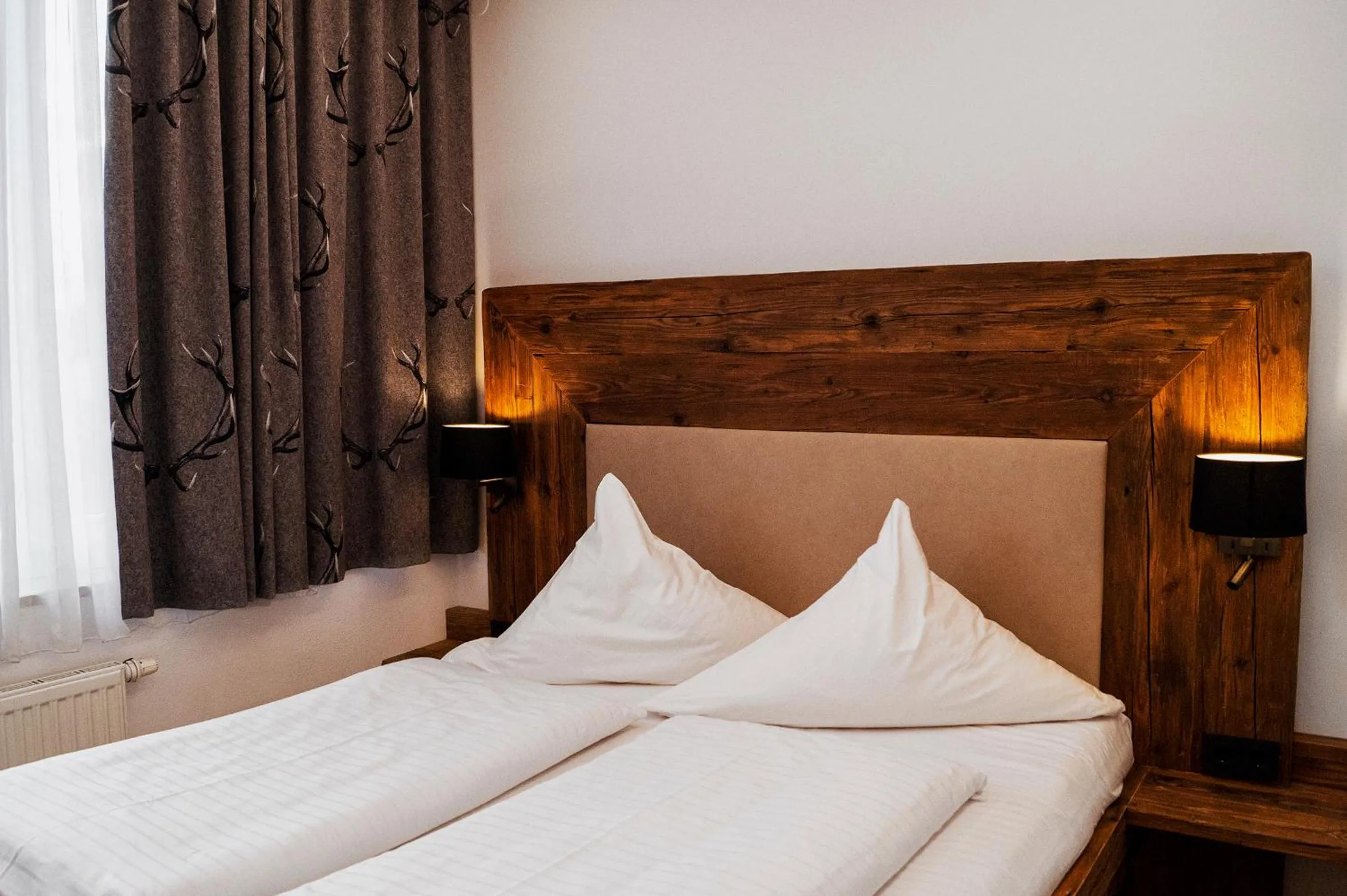 Bed in Hotel Almwirt