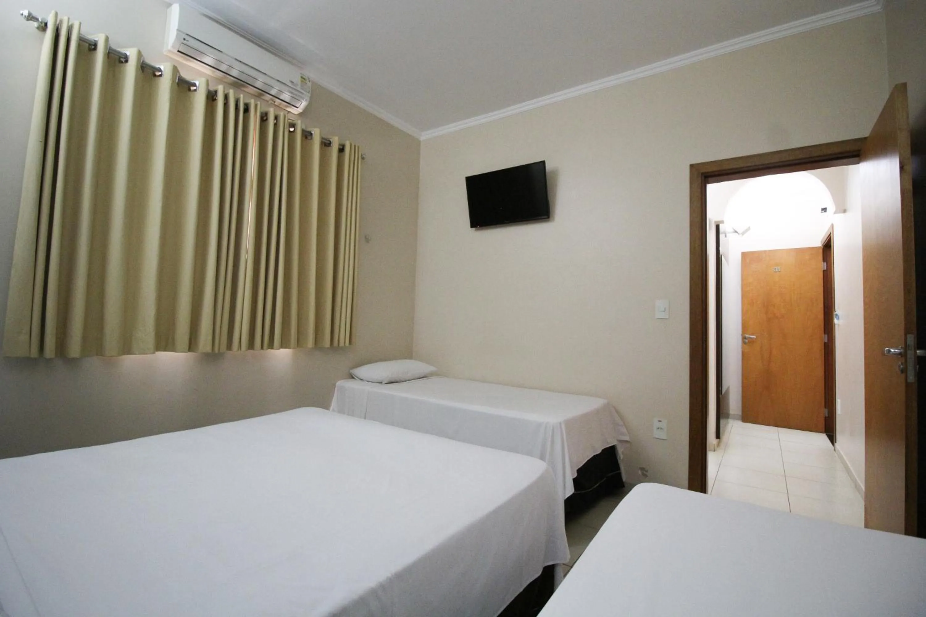 Bed in VOA Pousada Água Eterna