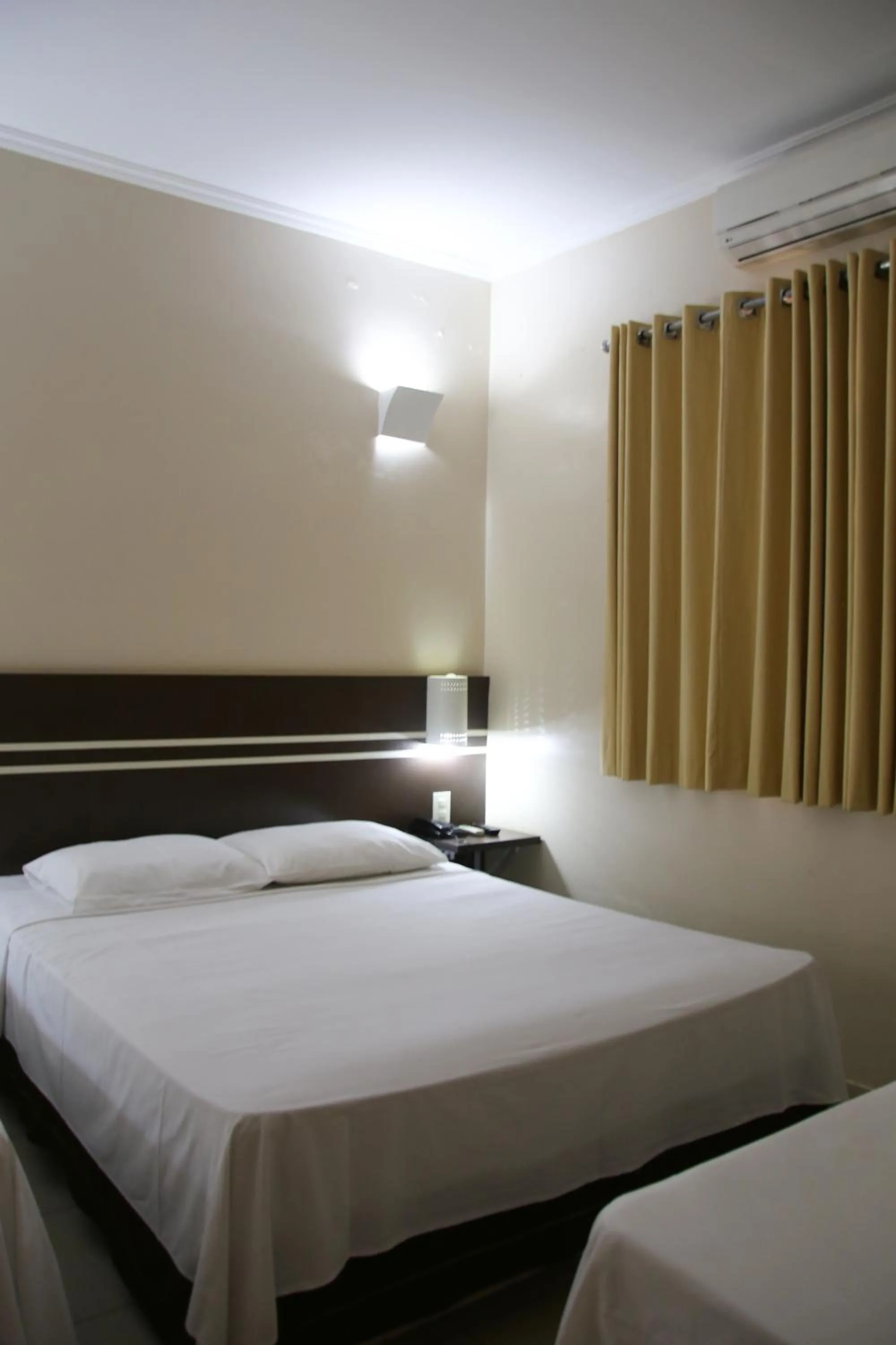 Bed in VOA Pousada Água Eterna