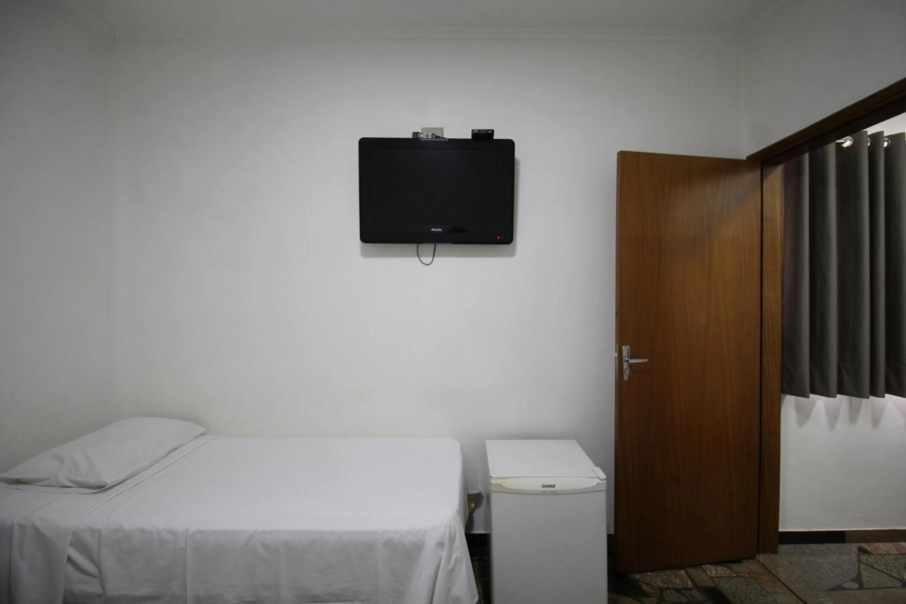 Bed in VOA Pousada Água Eterna