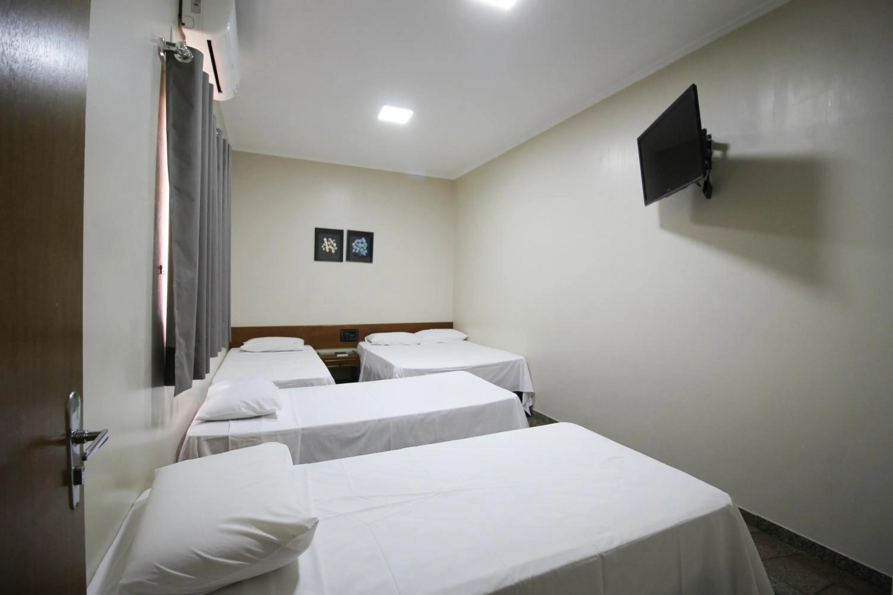 Bed in VOA Pousada Água Eterna