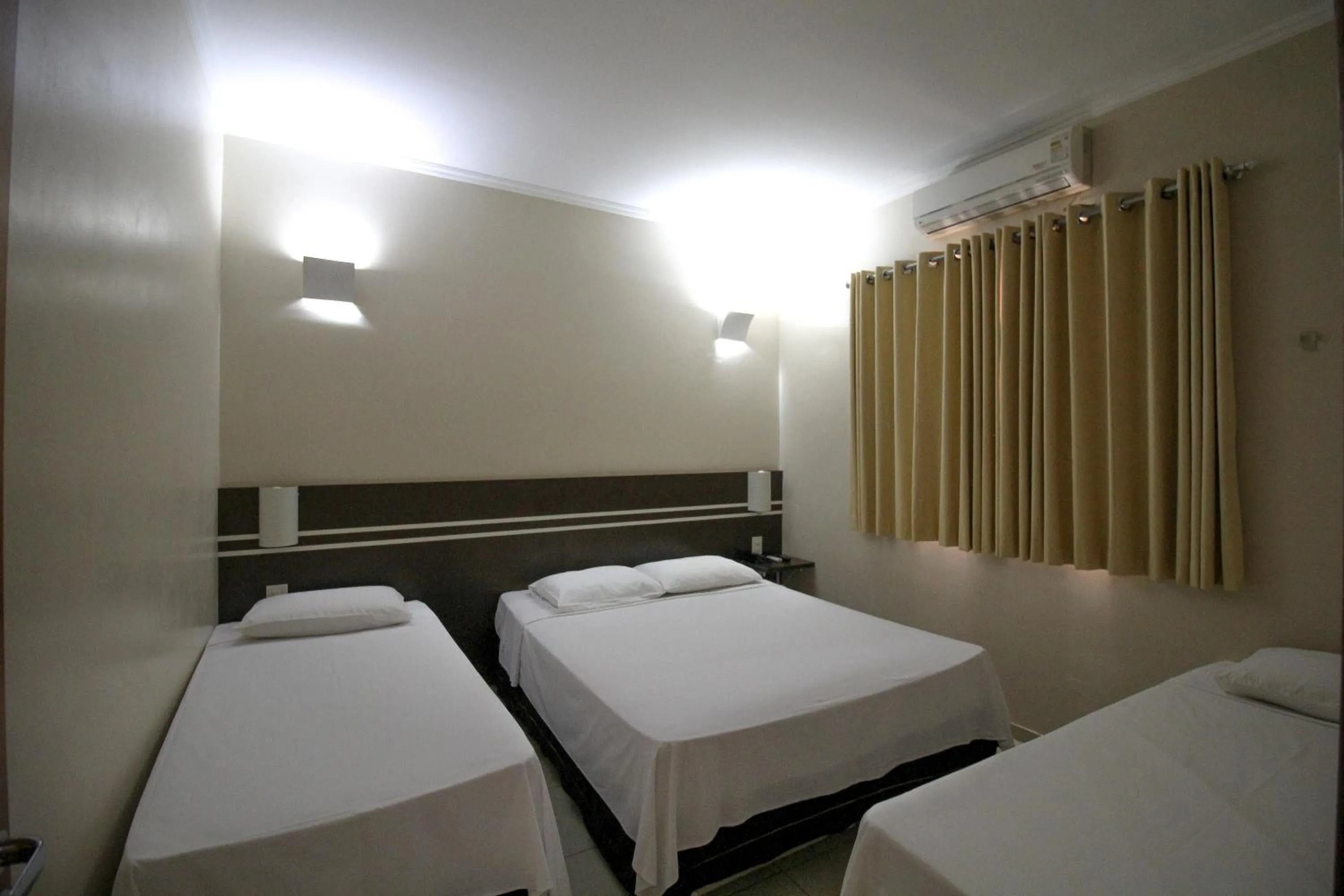 Bed in VOA Pousada Água Eterna