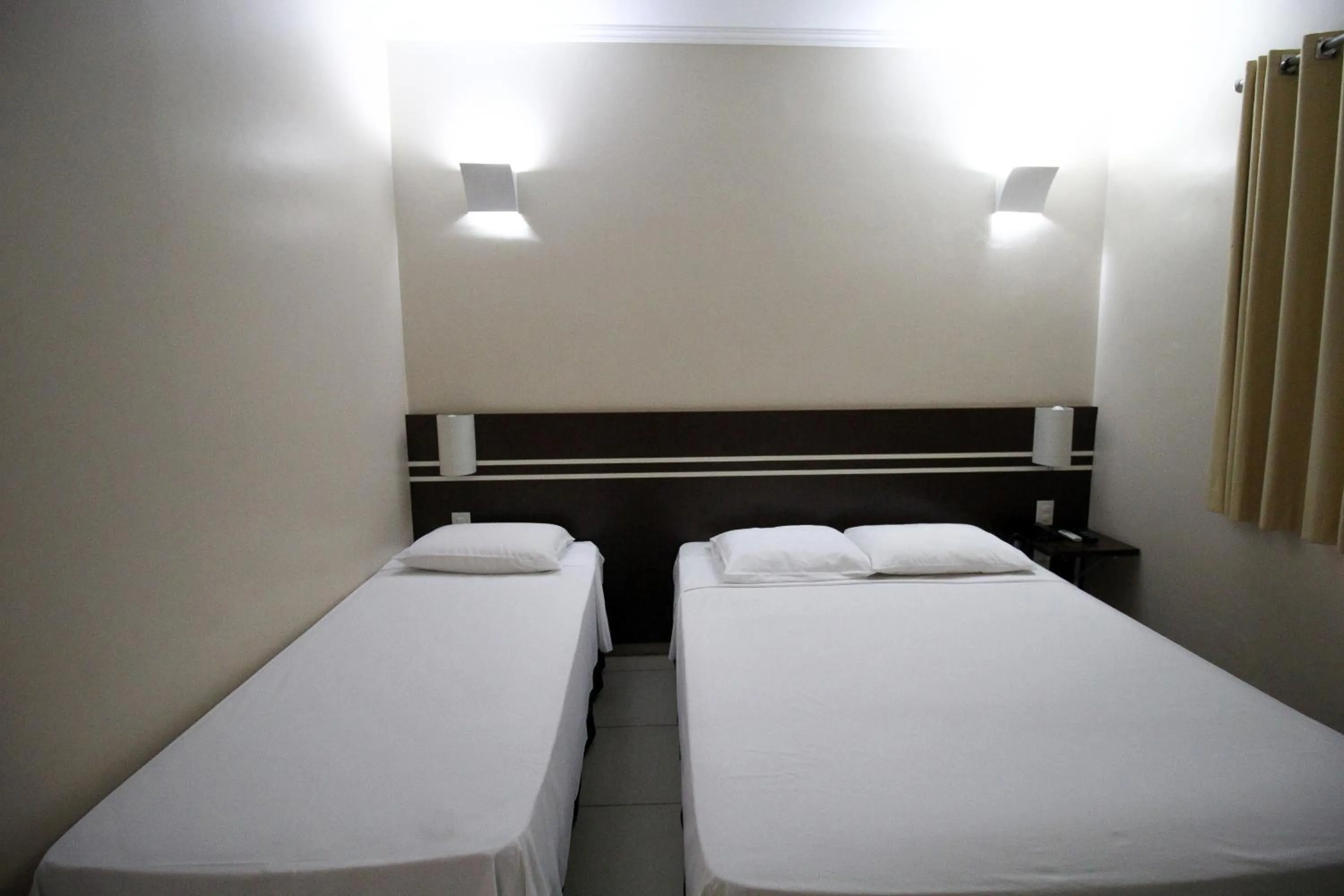 Bed in VOA Pousada Água Eterna