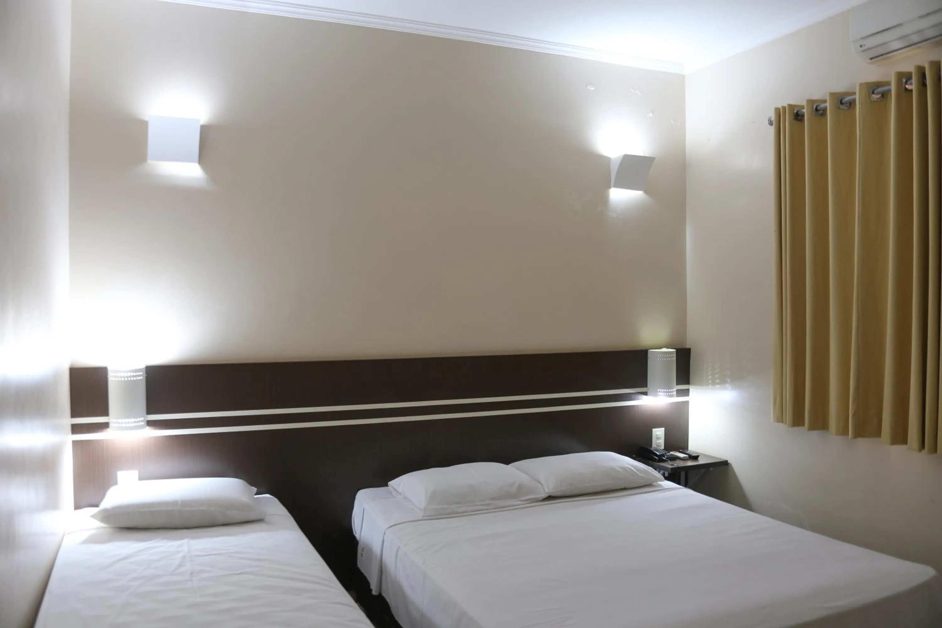 Bed in VOA Pousada Água Eterna