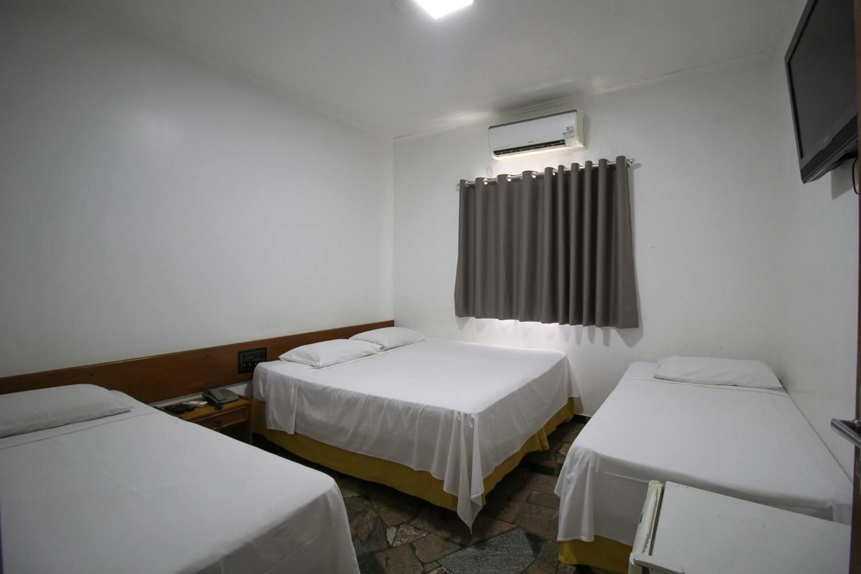 Bed in VOA Pousada Água Eterna