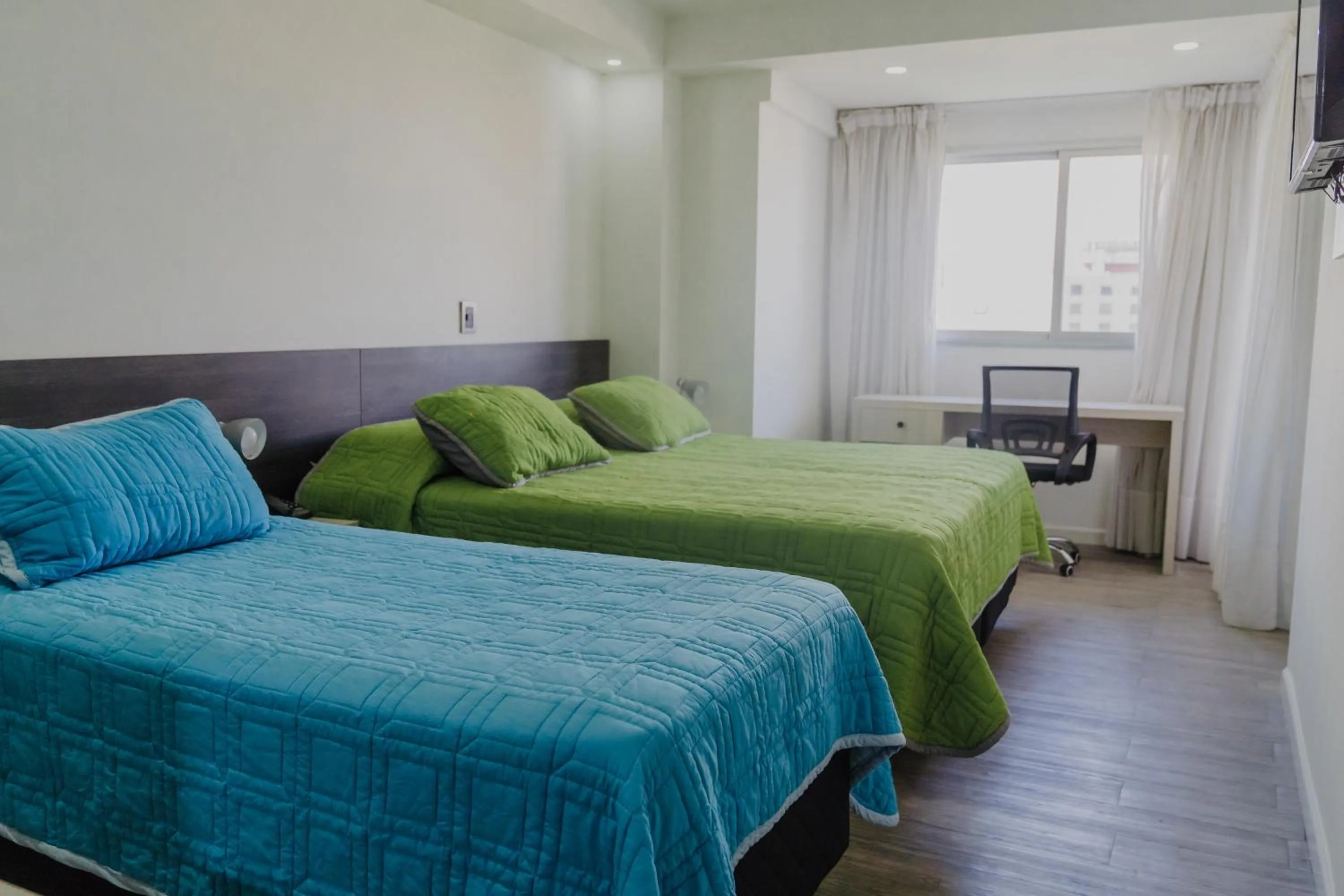 Bed in Quijano Hotel - Aparts & Suites