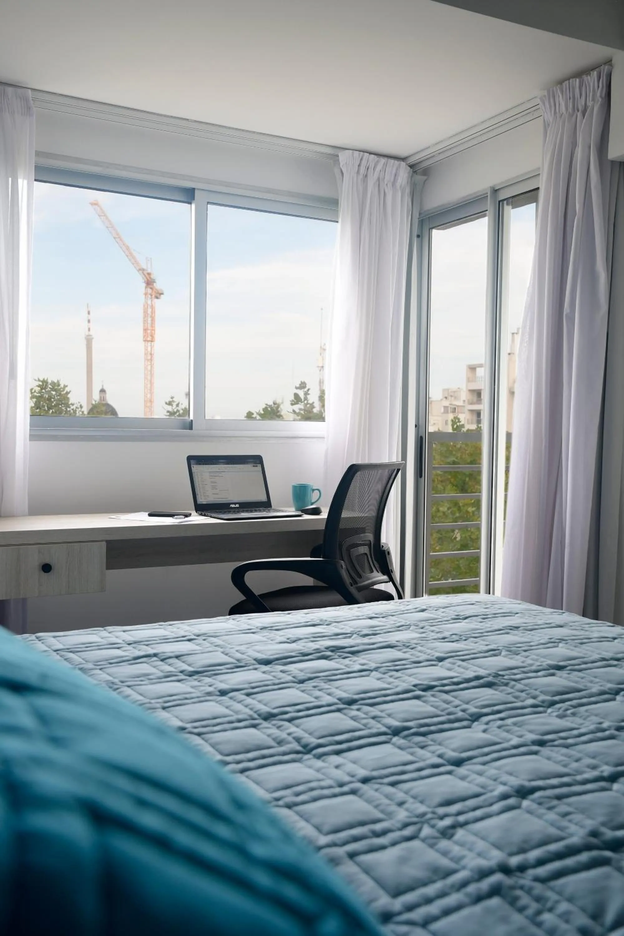 Seating area, Bed in Quijano Hotel - Aparts & Suites