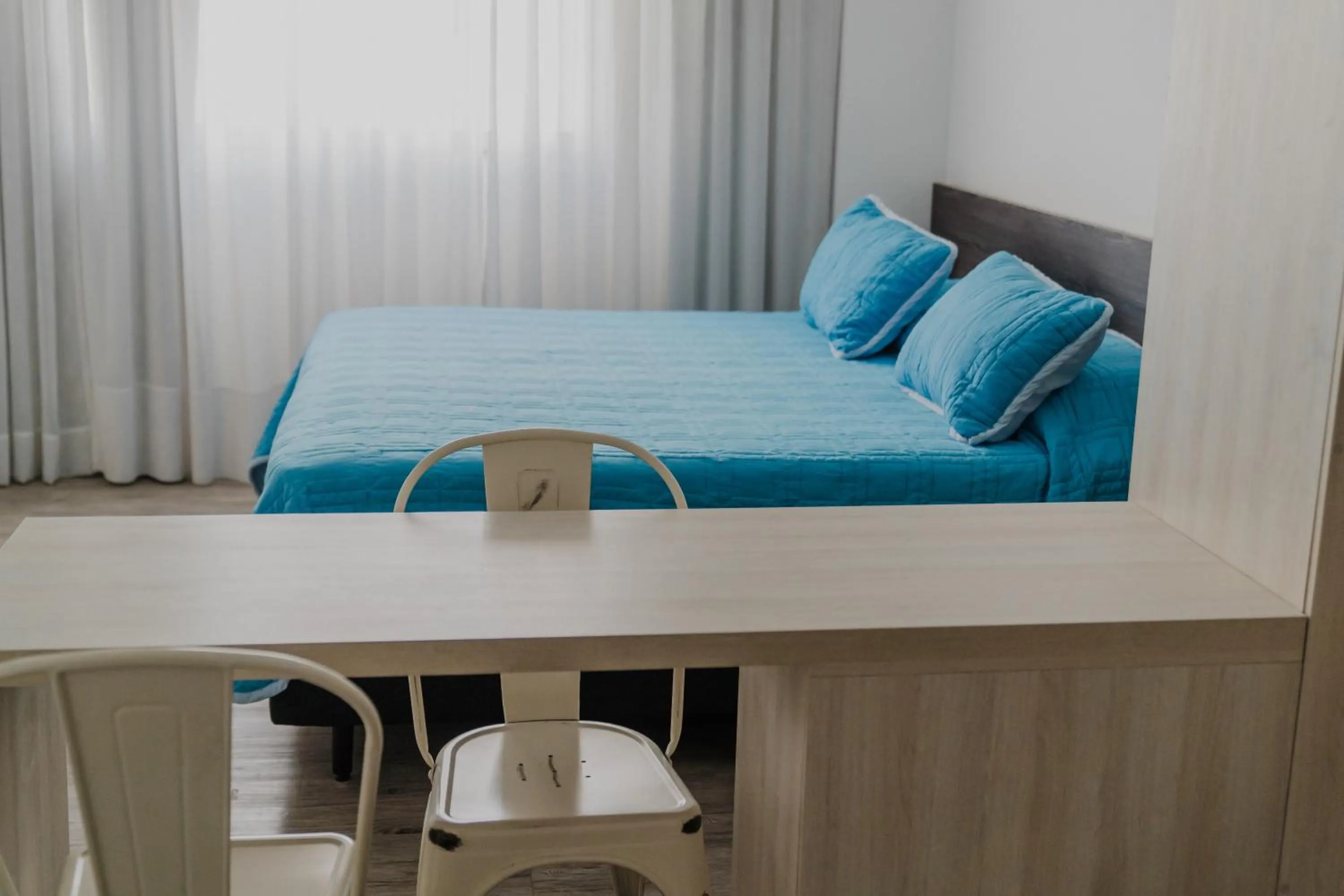 Photo of the whole room, Bed in Quijano Hotel - Aparts & Suites