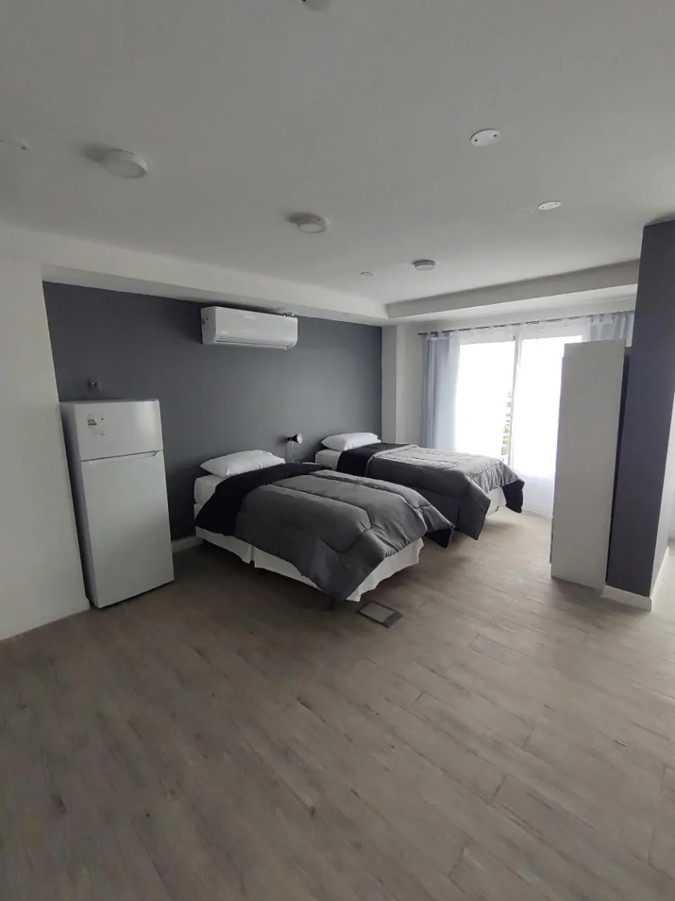 Photo of the whole room, Bed in Quijano Hotel - Aparts & Suites