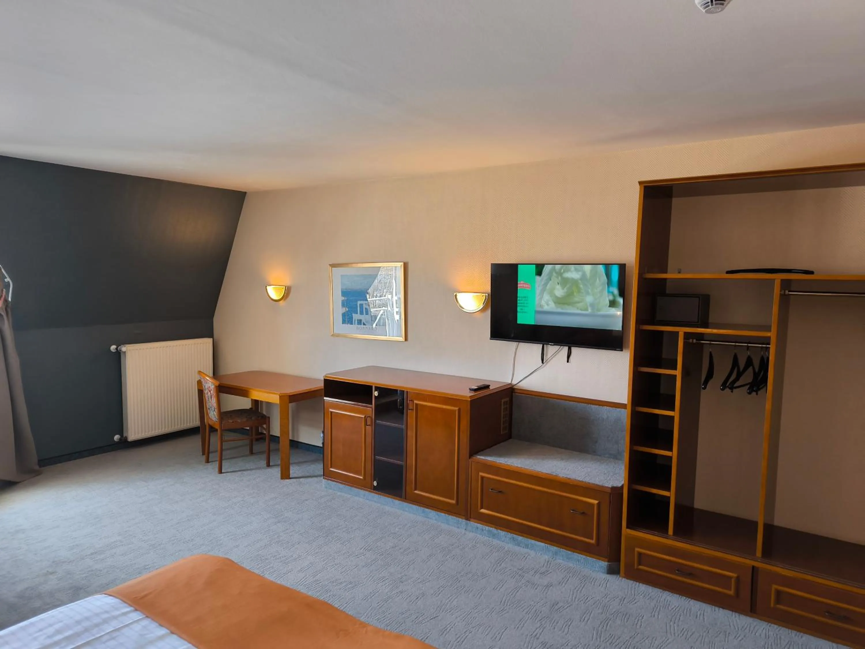 Seating area, Bed in Hotel am Park