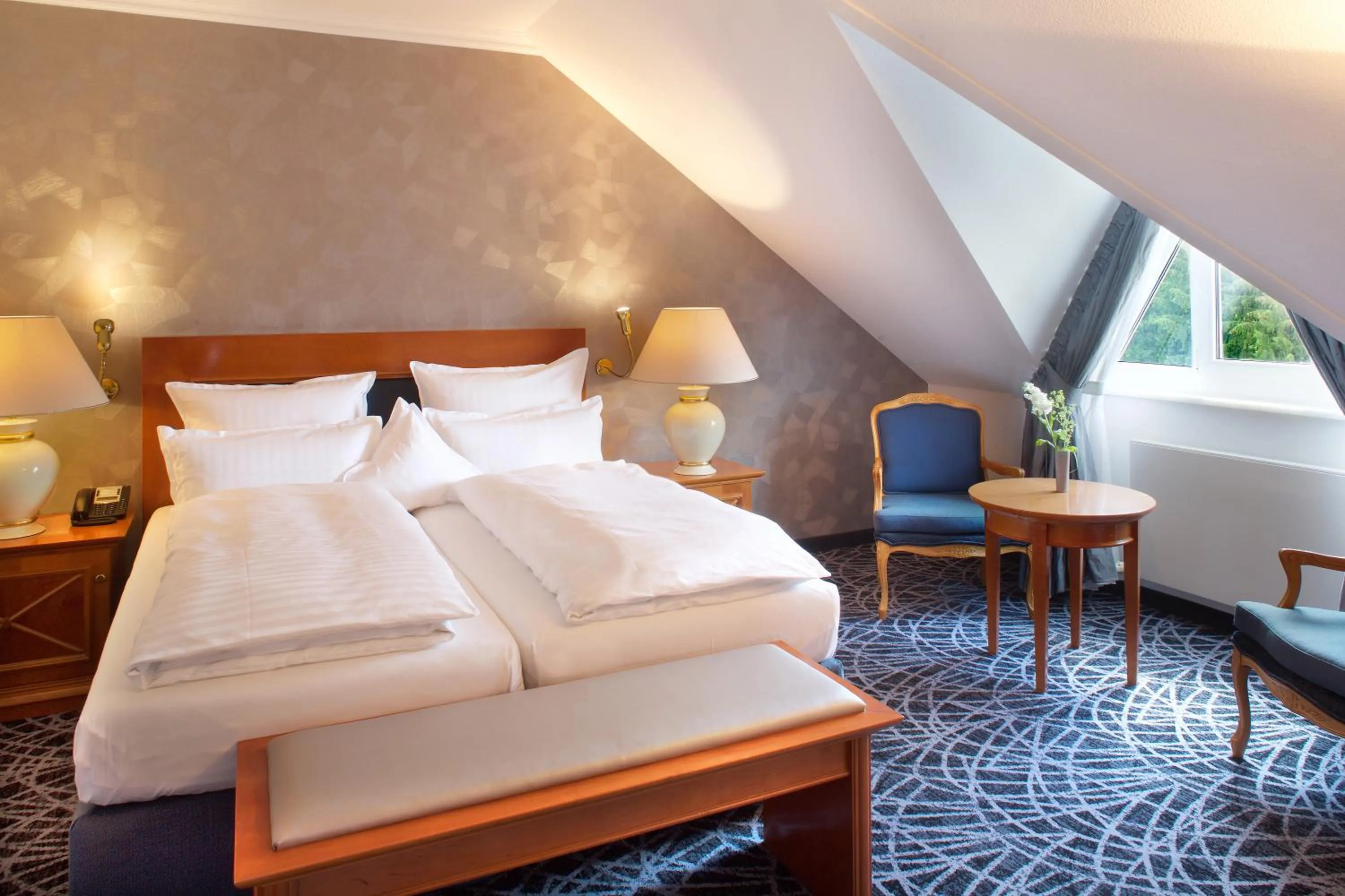 Photo of the whole room, Bed in Steigenberger Hotel Der Sonnenhof