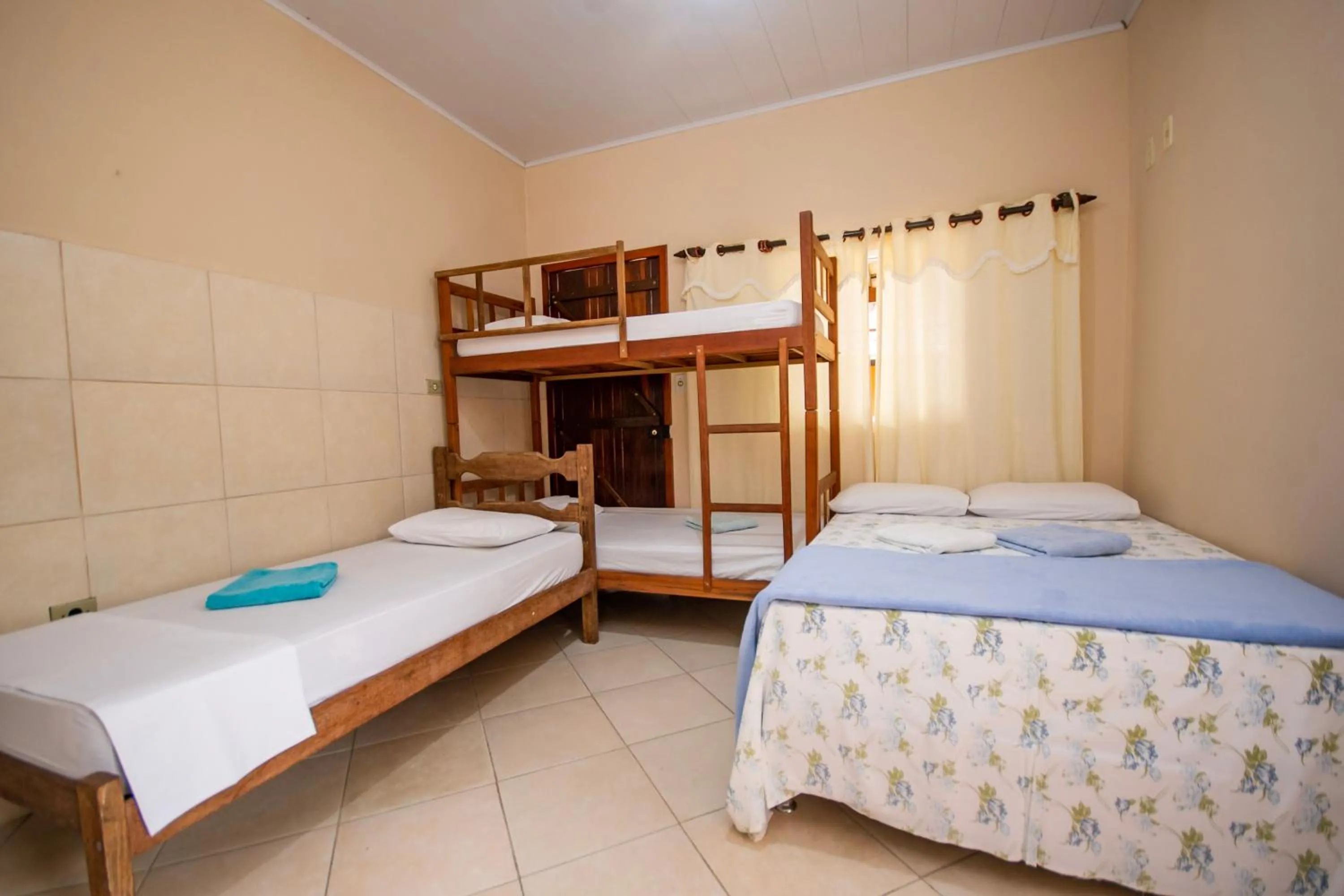 Bed in Pousada Quatro Estações Paraty