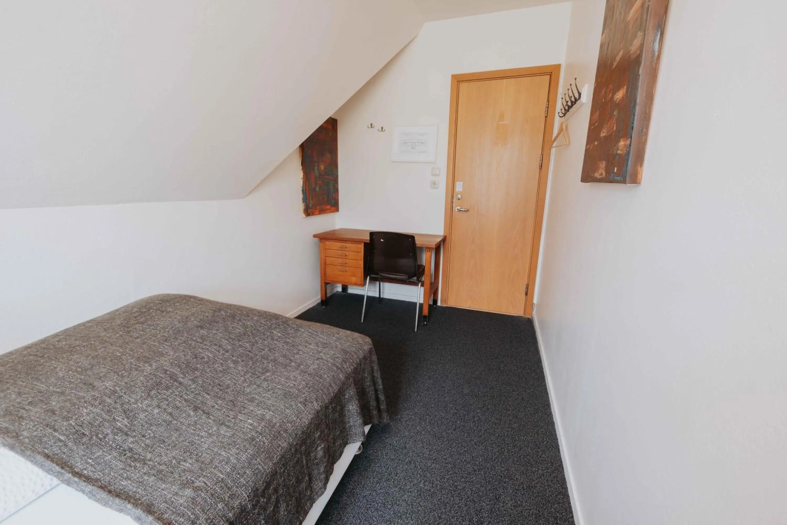 Bed in Héradsskólinn Historic Guesthouse