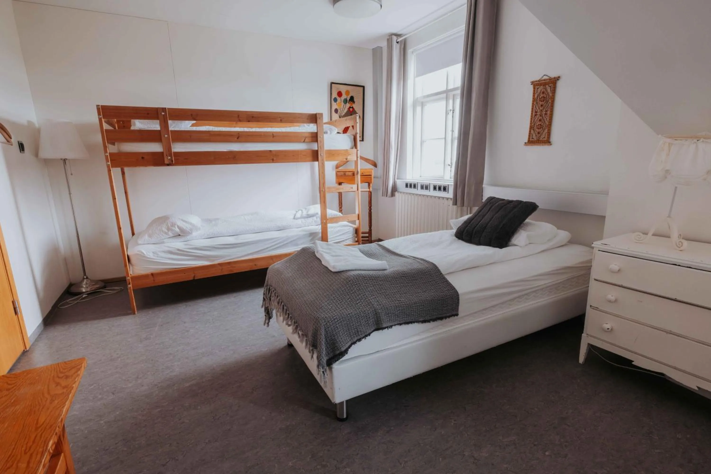 Bed in Héradsskólinn Historic Guesthouse