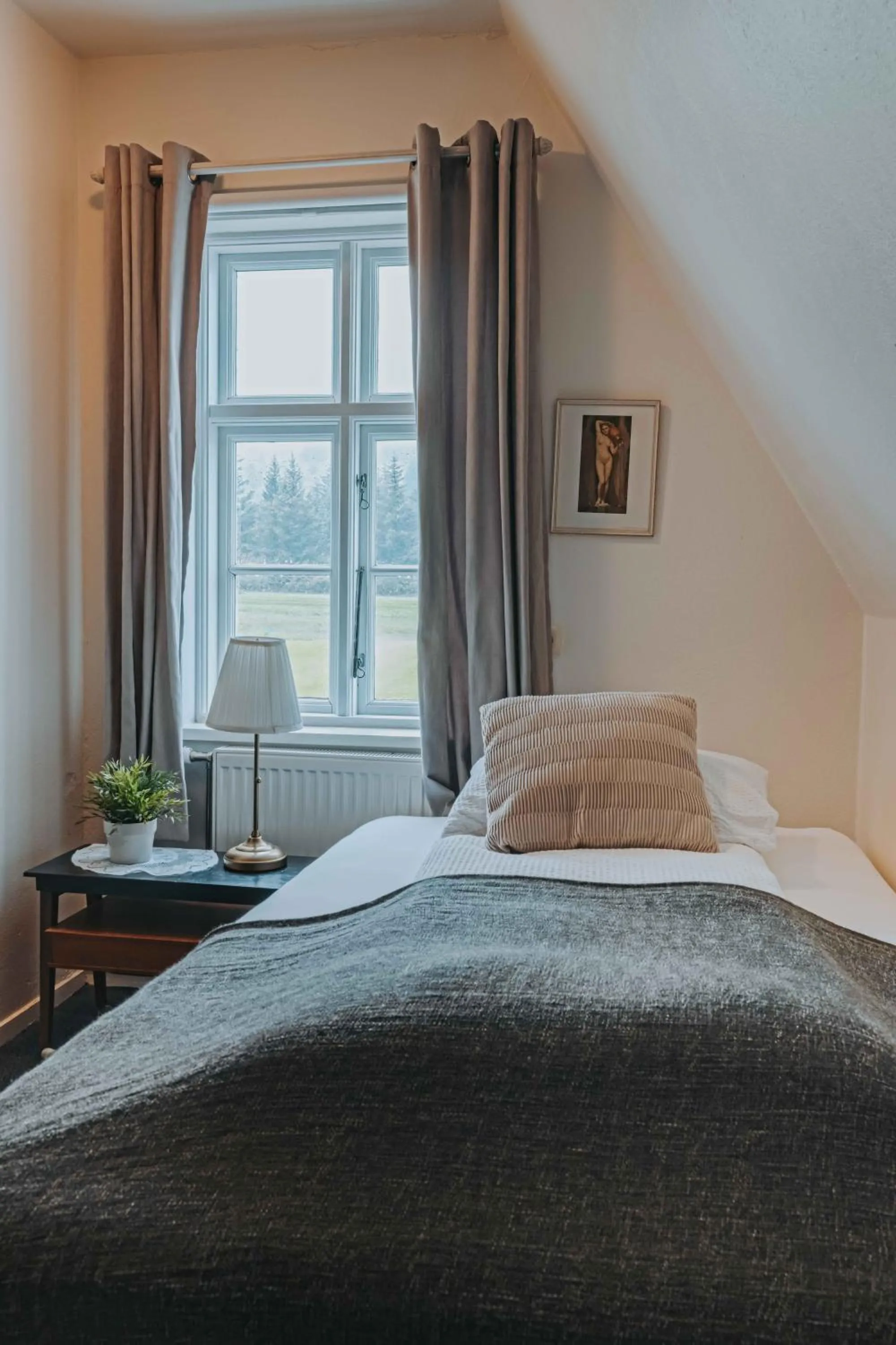 Bed in Héradsskólinn Historic Guesthouse