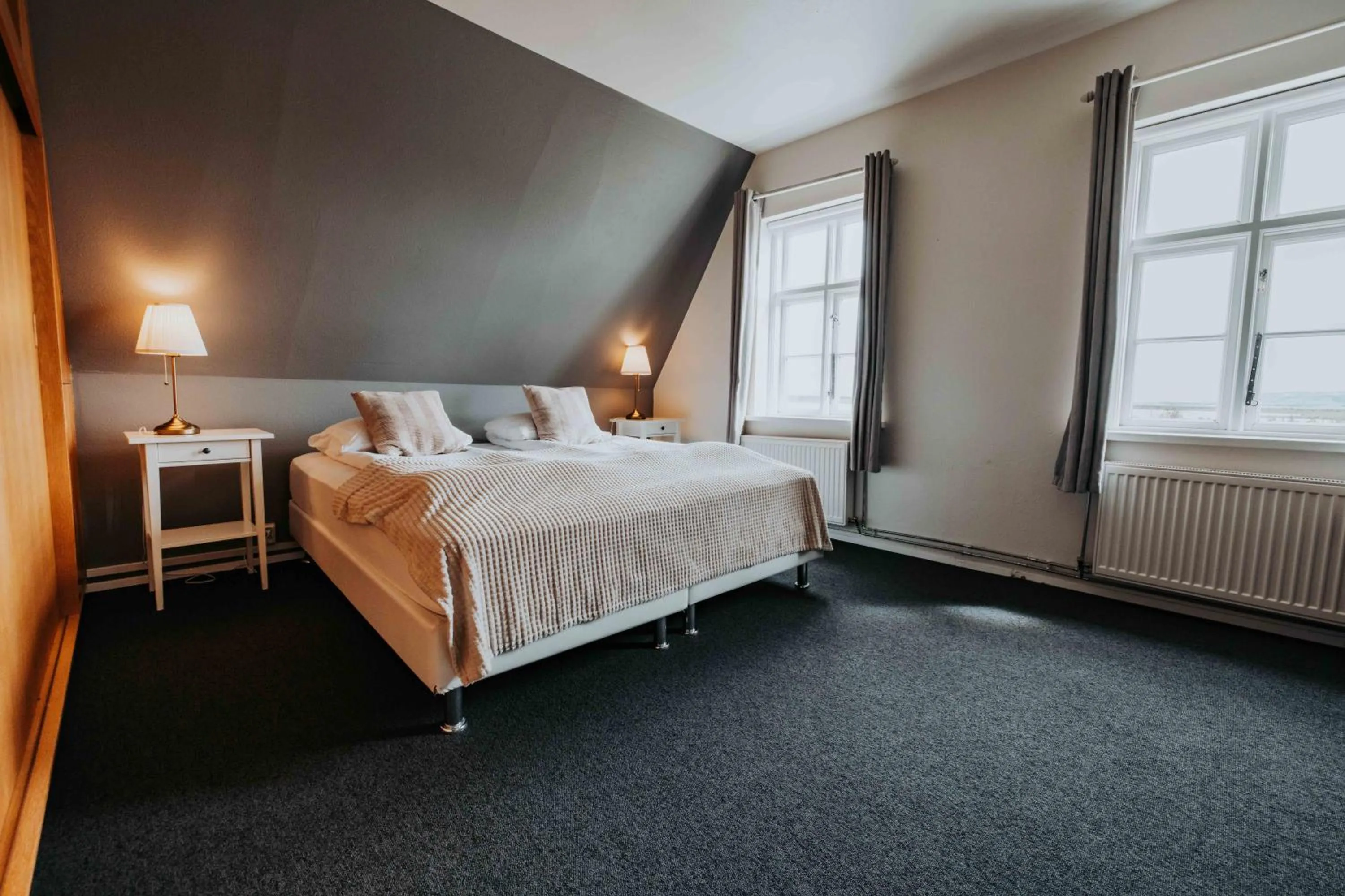 Bed in Héradsskólinn Historic Guesthouse