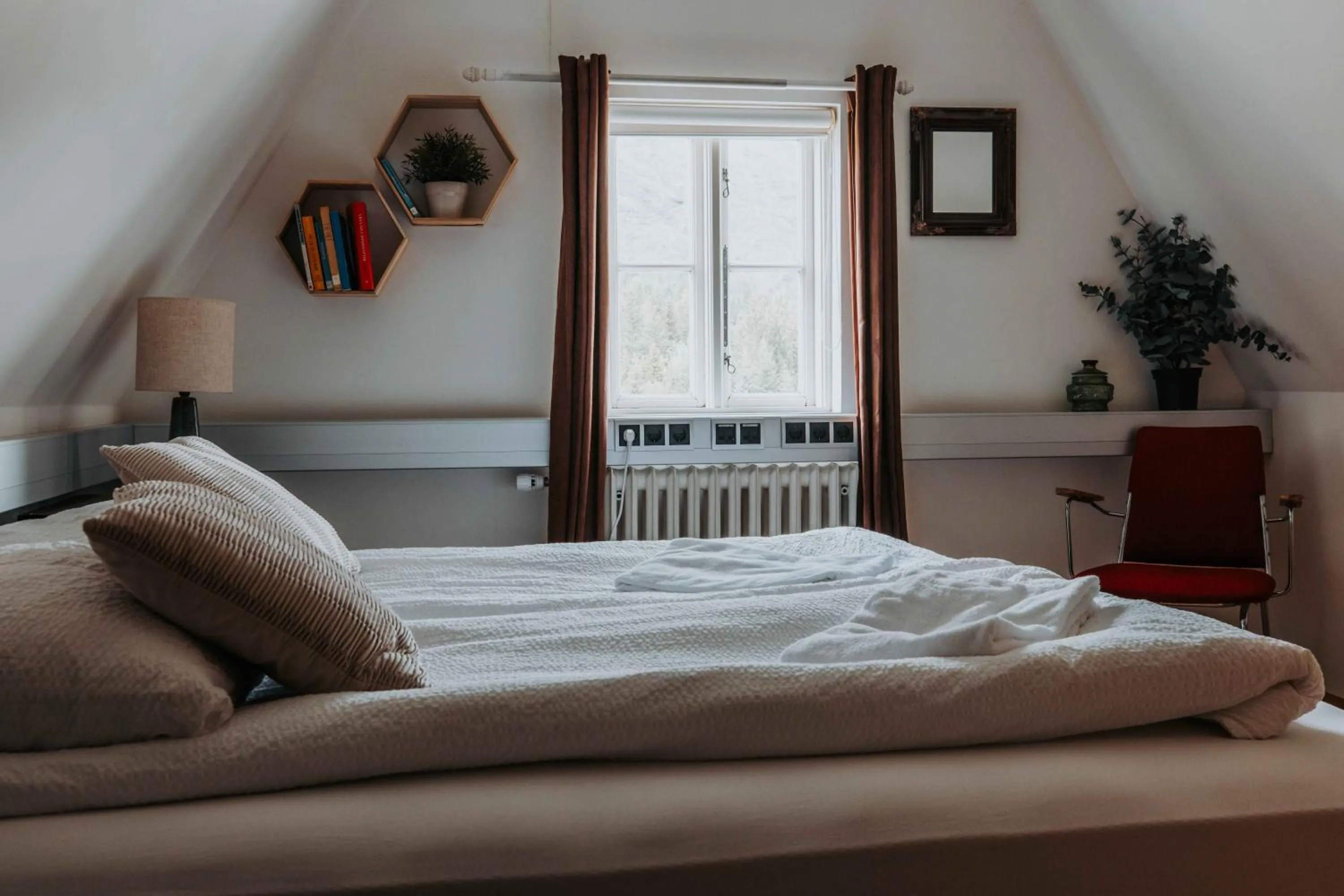 Bed in Héradsskólinn Historic Guesthouse