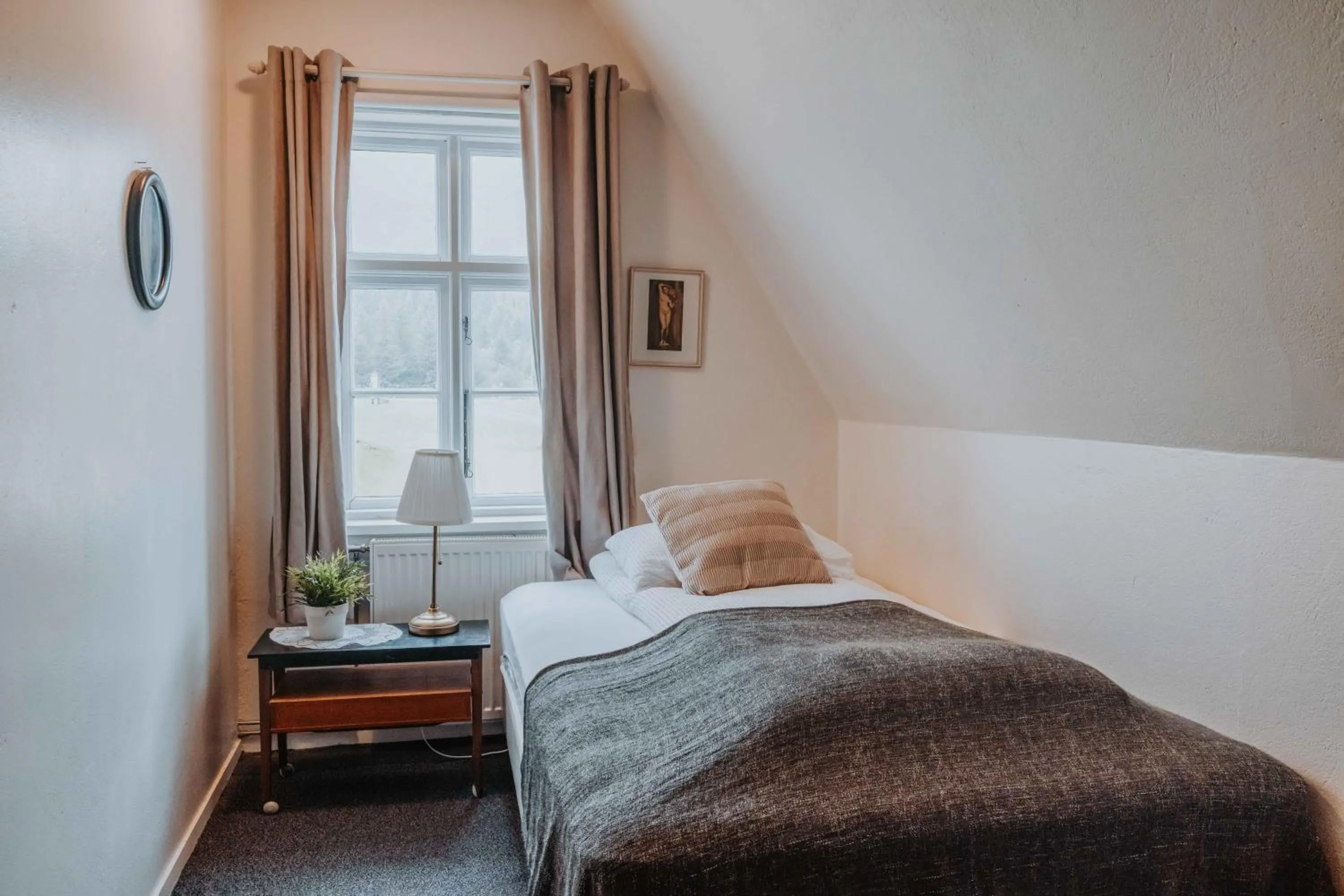 Bed in Héradsskólinn Historic Guesthouse