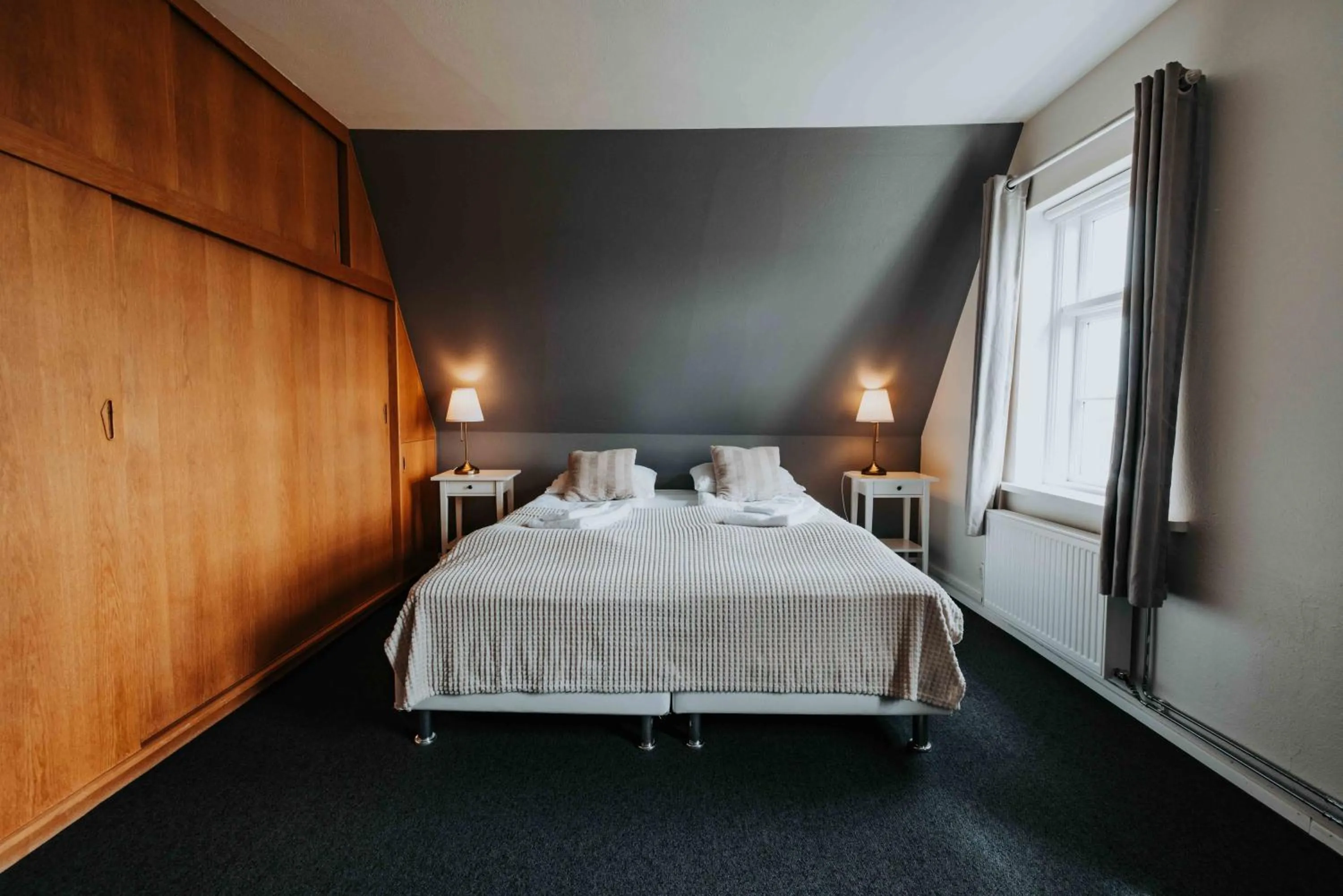 Bed in Héradsskólinn Historic Guesthouse