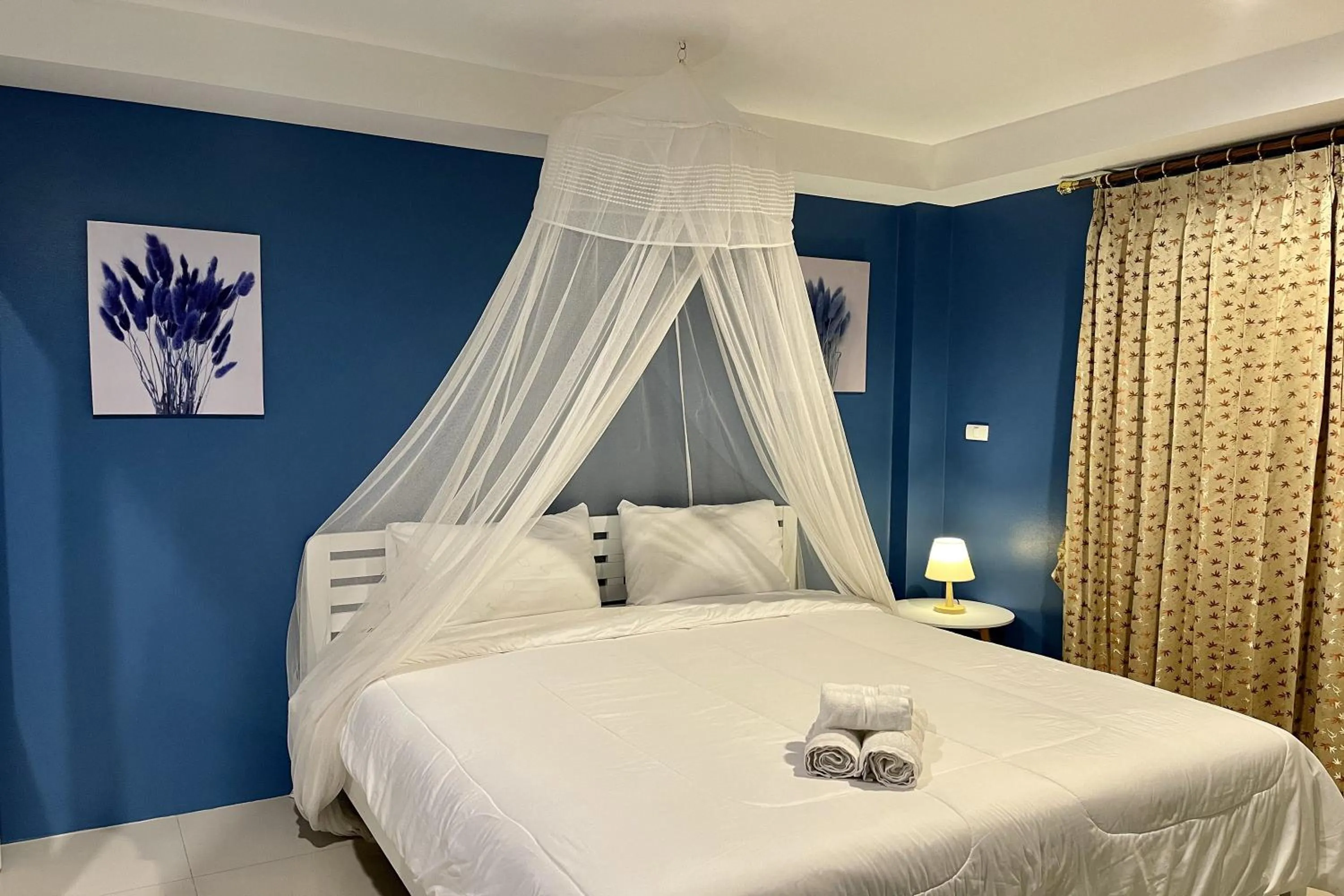 Bed in Be Rich Hotel