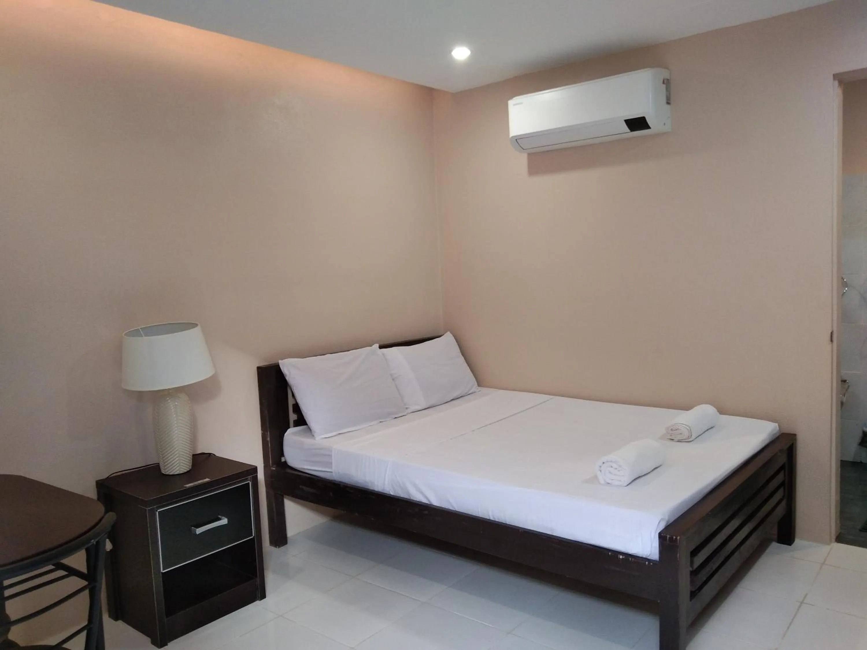 Photo of the whole room, Bed in Claytown Pension House