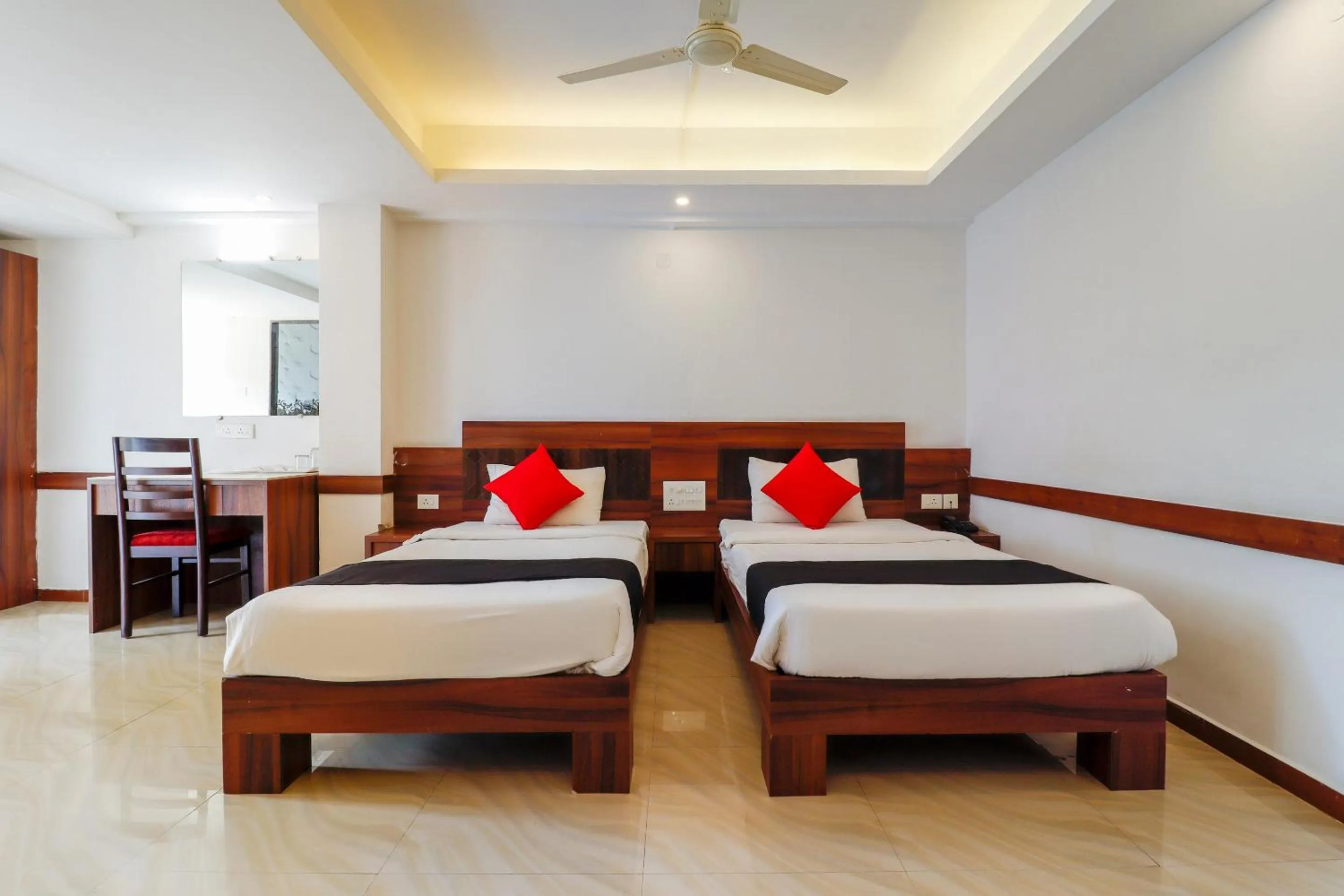 Bedroom, Bed in Capital O Sai Arya Residency
