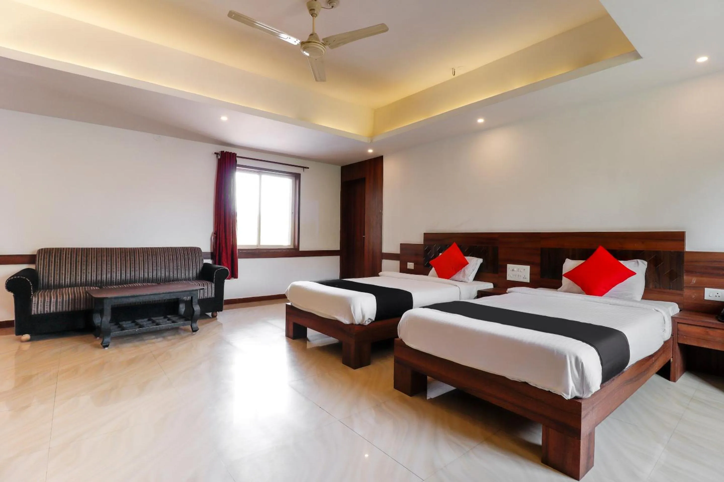 Bedroom, Bed in Capital O Sai Arya Residency