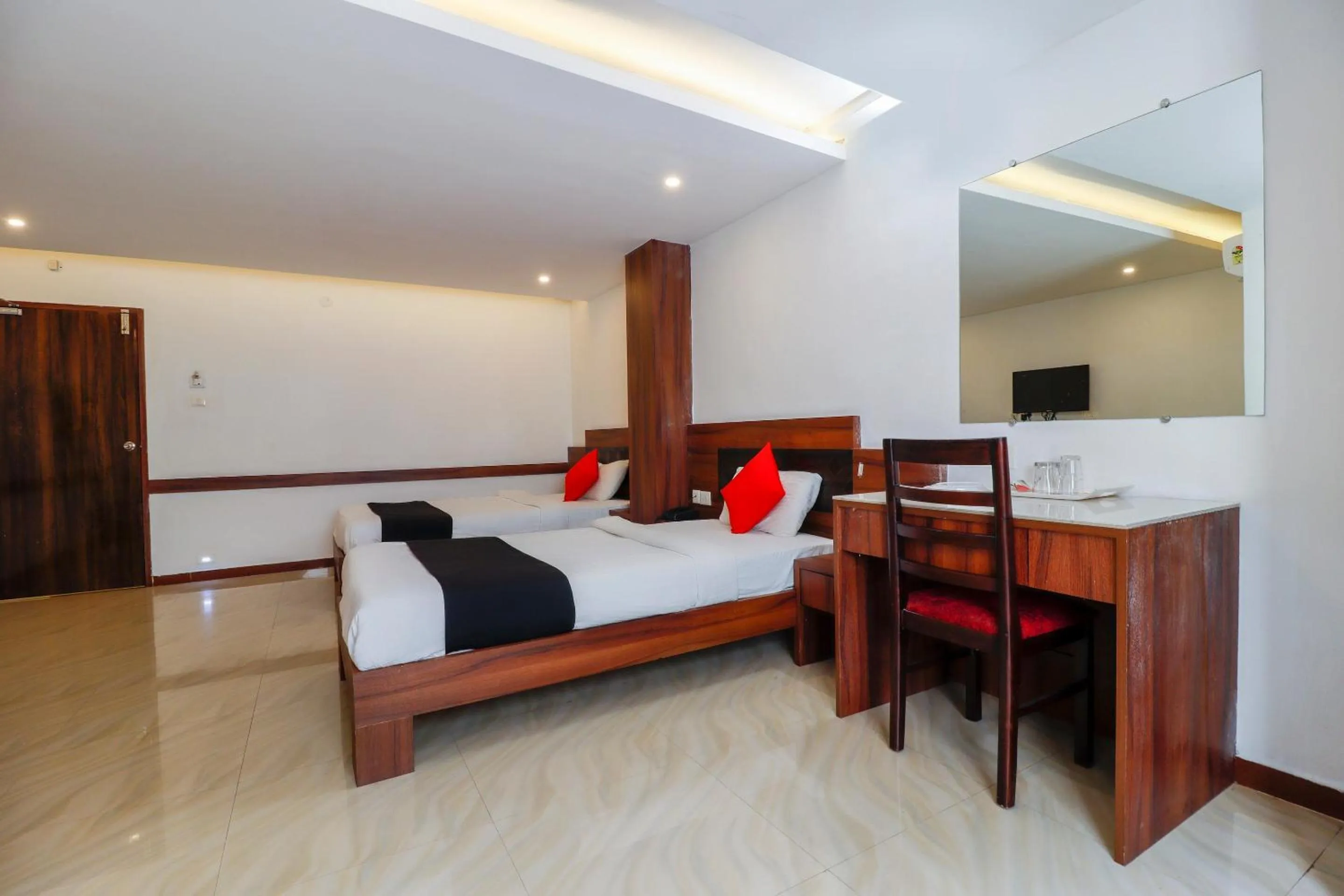 Bedroom, Bed in Capital O Sai Arya Residency