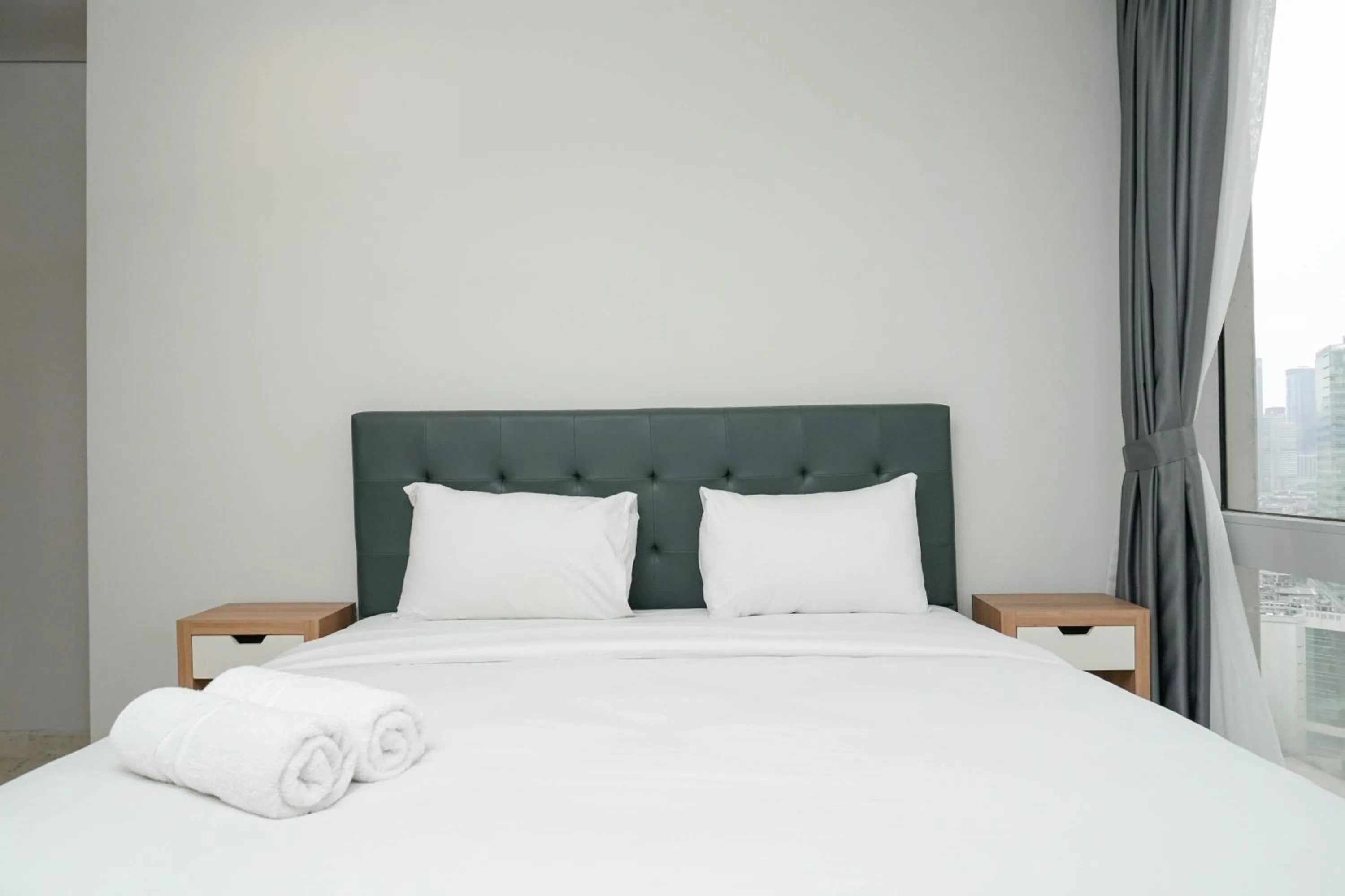 Two-Bedroom Apartment in Cozy 2BR at Empyreal Epicentrum Apartment By Travelio