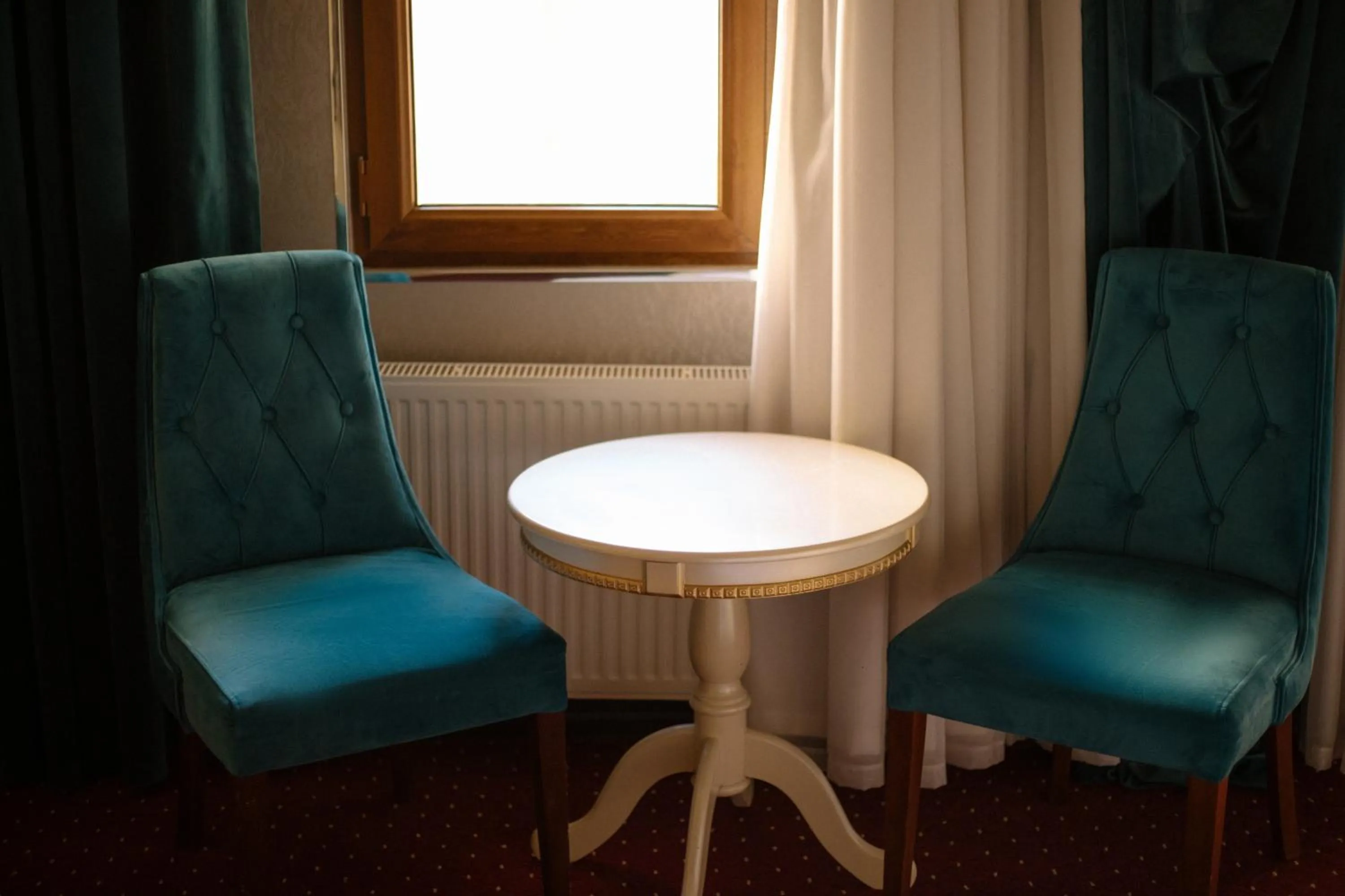 Seating area in Dendi Plaza Hotel