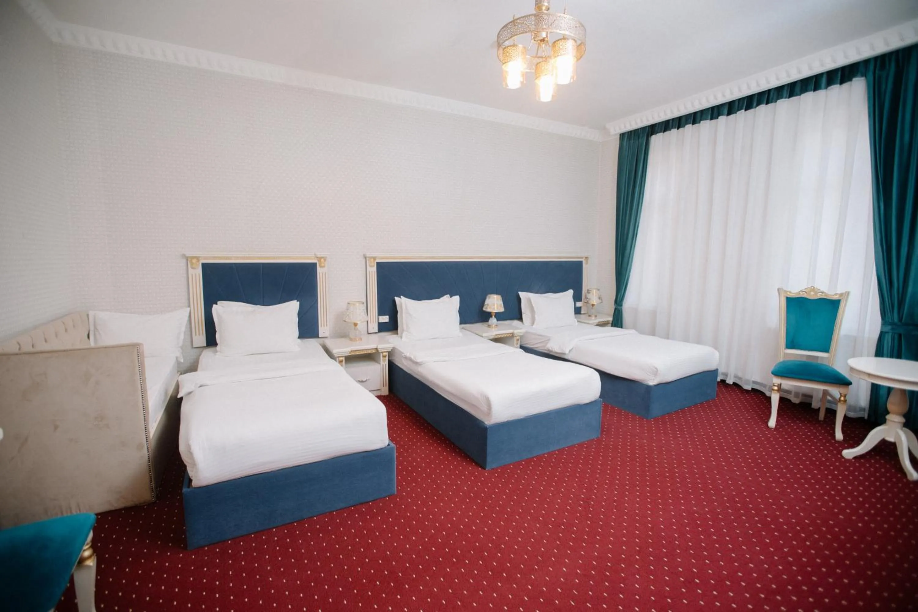Bed in Dendi Plaza Hotel