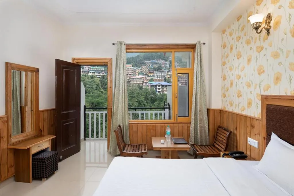 Bed in McLeod Ganj Mountain view