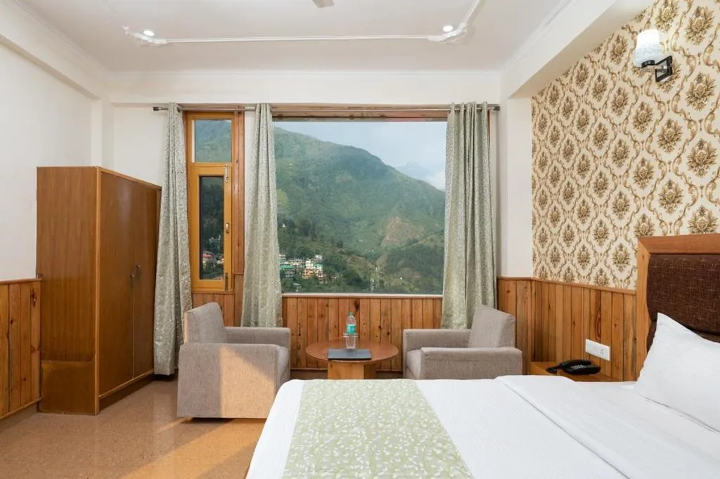 Bed in McLeod Ganj Mountain view