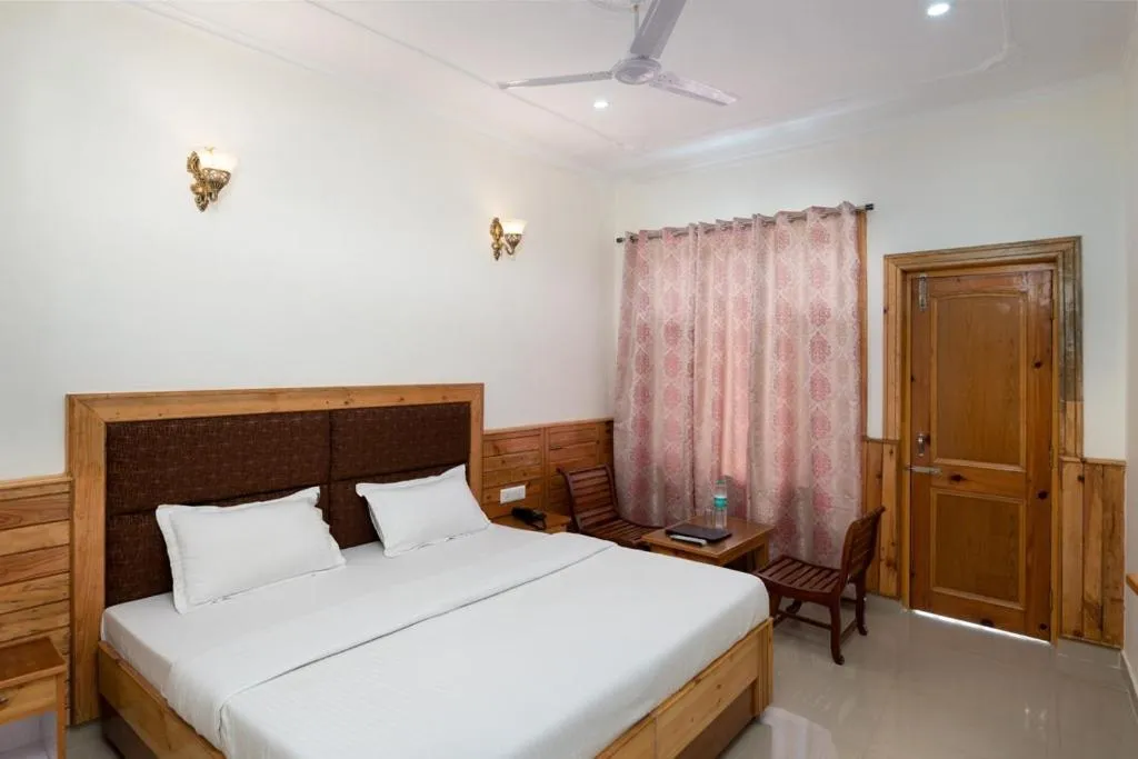 Bed in McLeod Ganj Mountain view