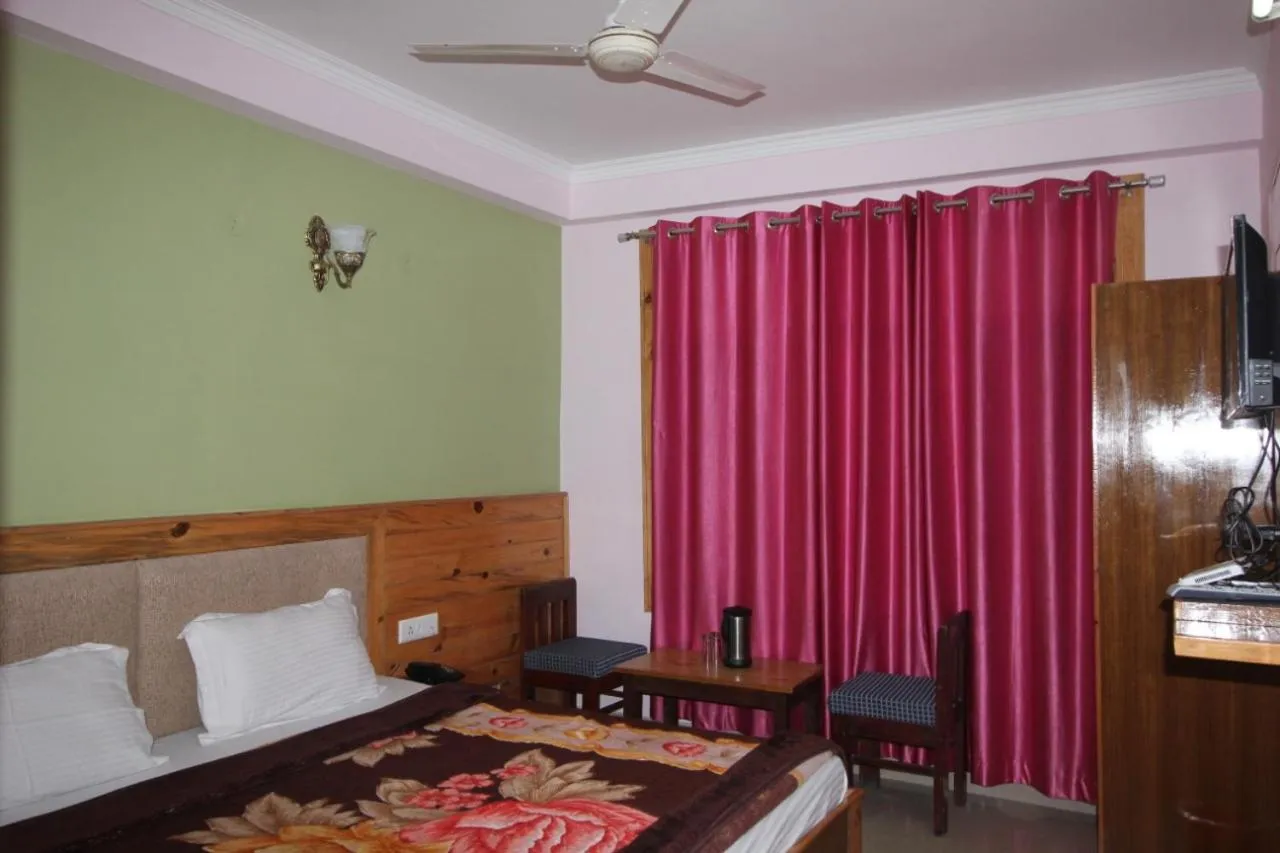 Bed in McLeod Ganj Mountain view