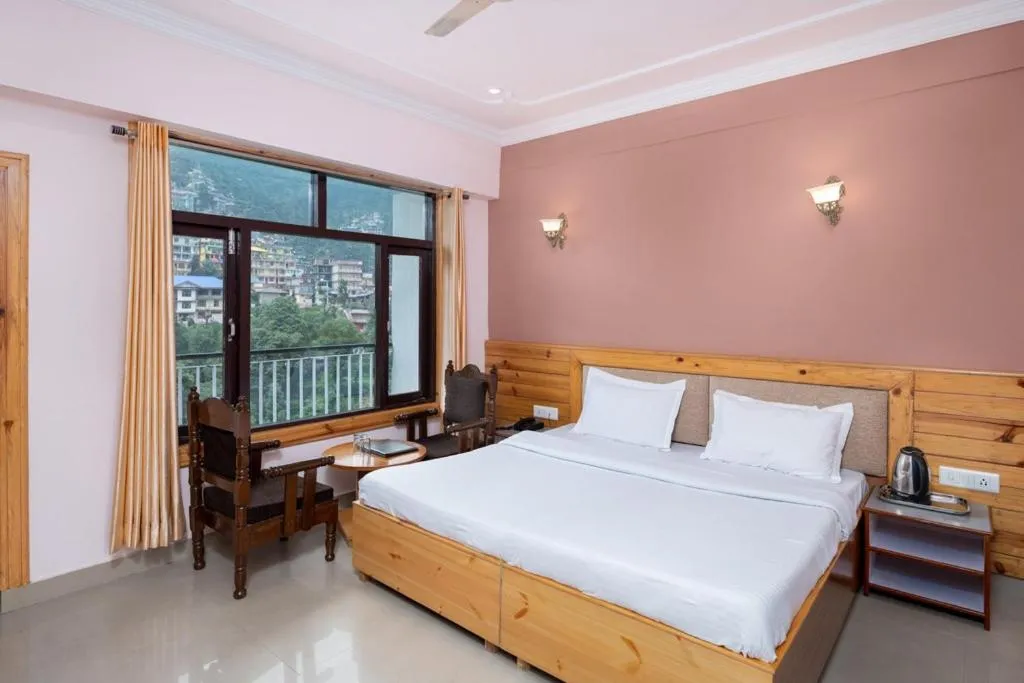 Bed in McLeod Ganj Mountain view