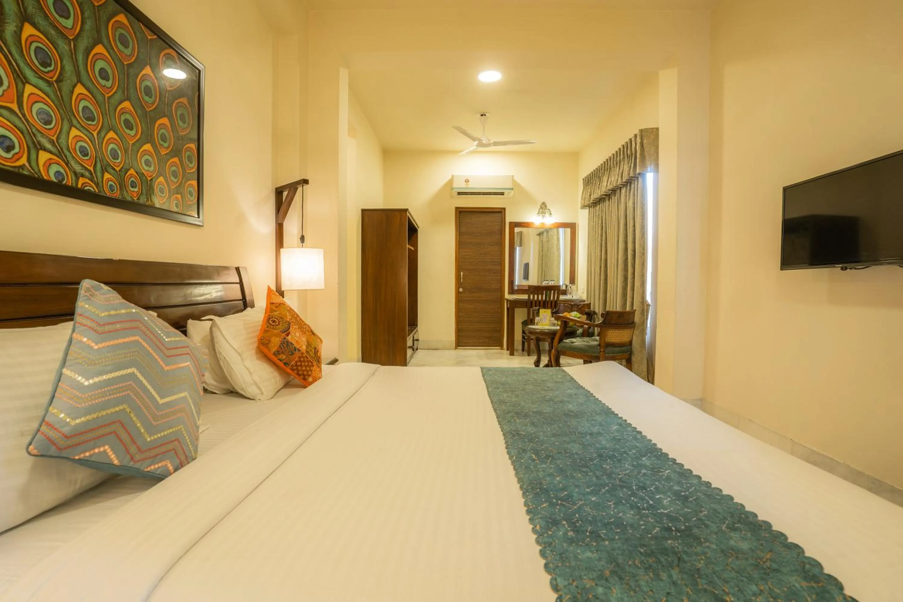 Bed in Tripli Hotels Shambhu Villas