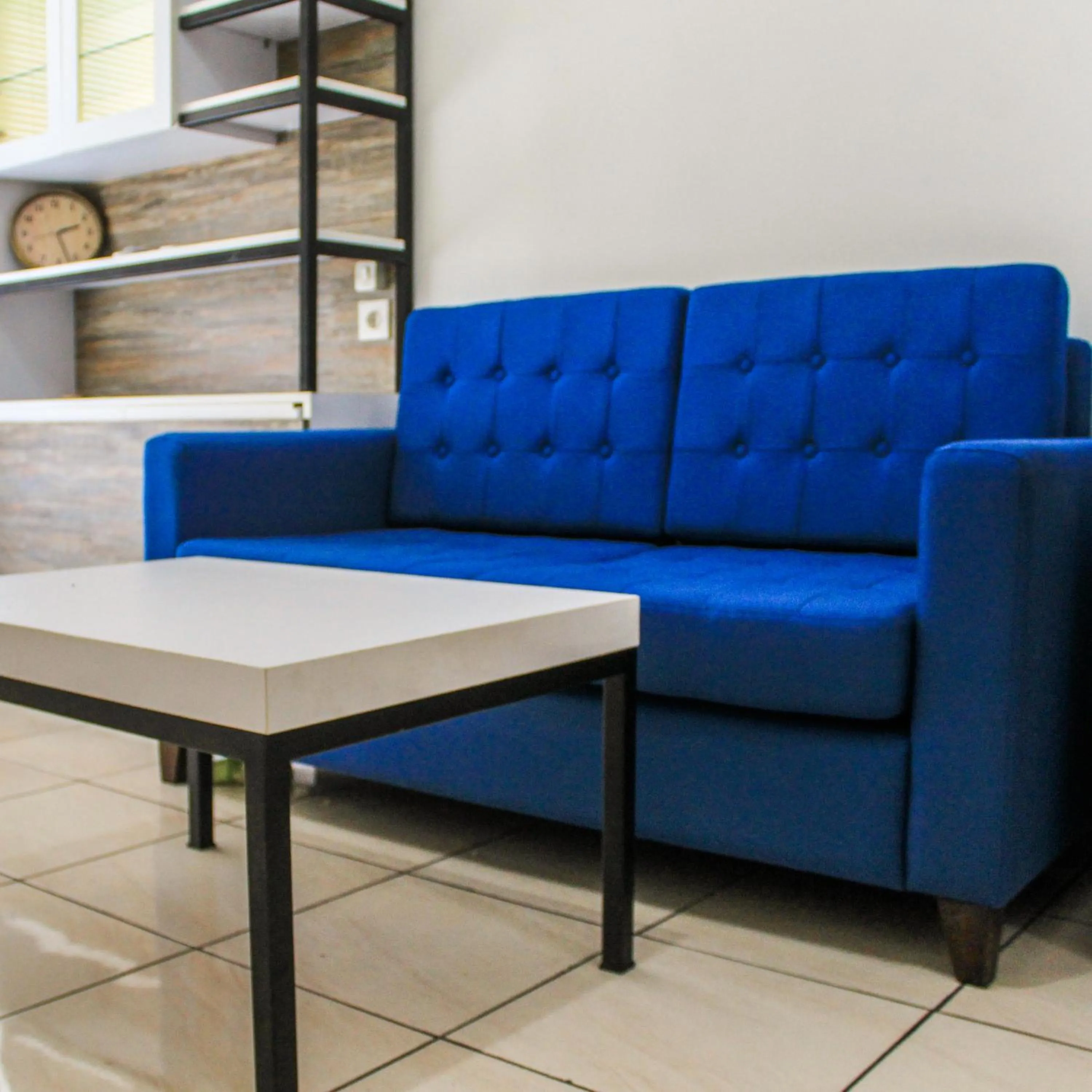 Living room in Relaxing 2BR Apartment at M-Town Residence By Travelio