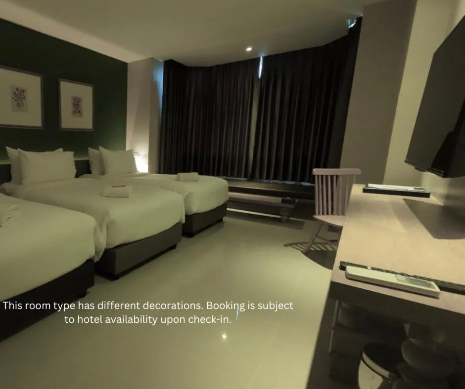 Bed in The Raintree Hotel Chiang Mai