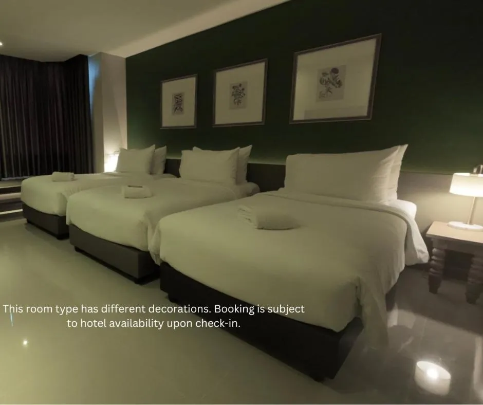 Bed in The Raintree Hotel Chiang Mai