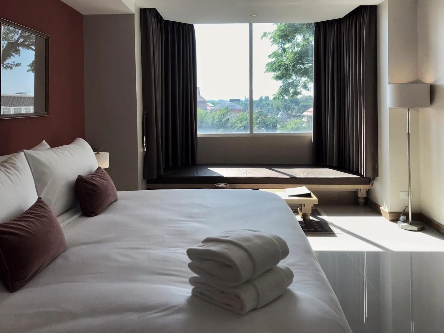 Bed in The Raintree Hotel Chiang Mai