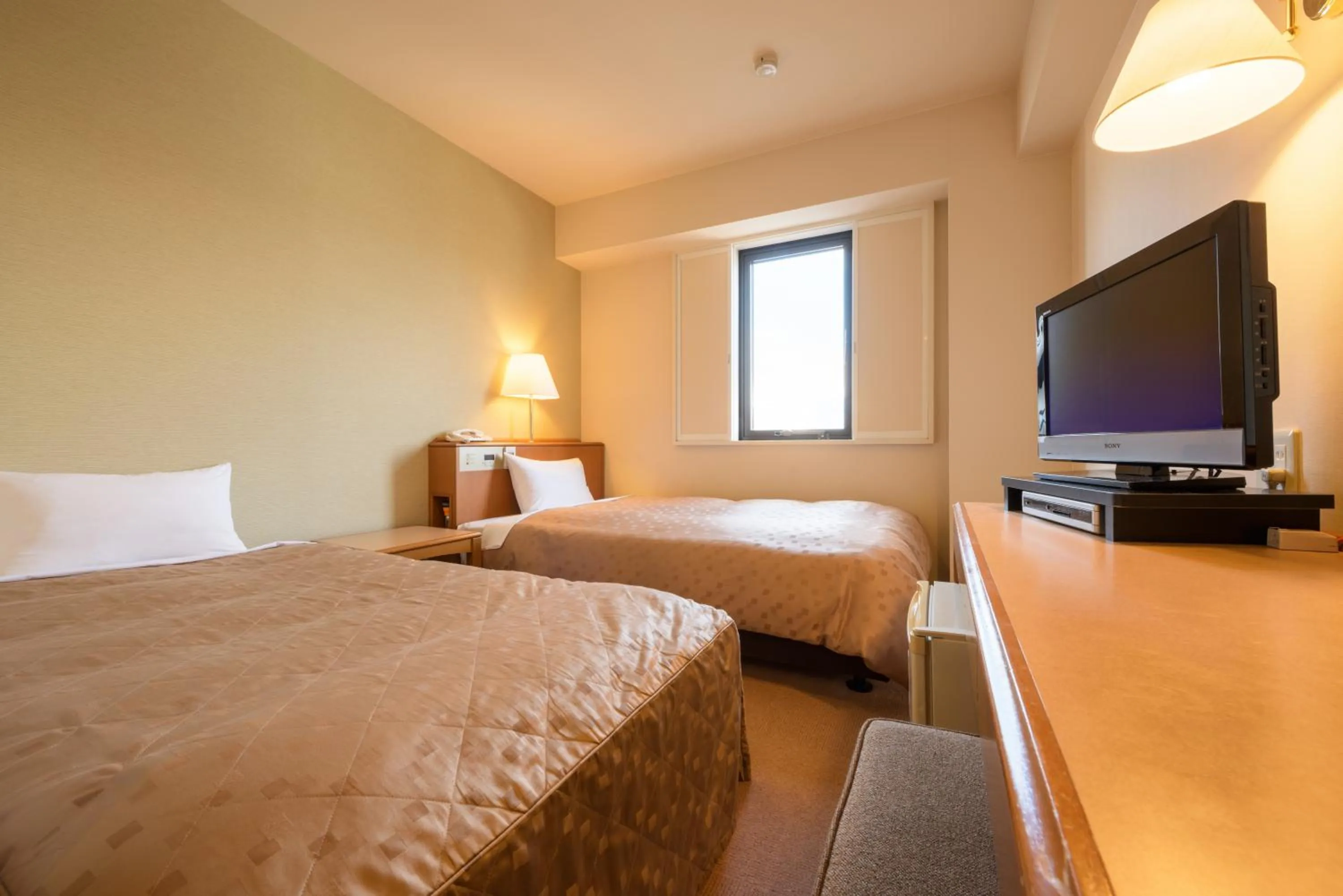 Photo of the whole room, Bed in Pacific Hotel Shiroishi